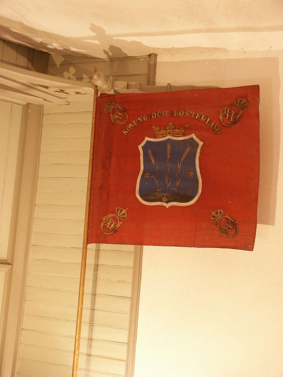Fana i vapenhuset, Litslena kyrka, Litslena socken, Uppland 2004