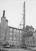 Uppsala stadsbibliotek och Centralbadets simhall under byggnation, Östra Ågatan, Uppsala april 1940