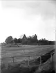 Landskapsvy med Tuna kyrka och klockstapel, Uppland 1921