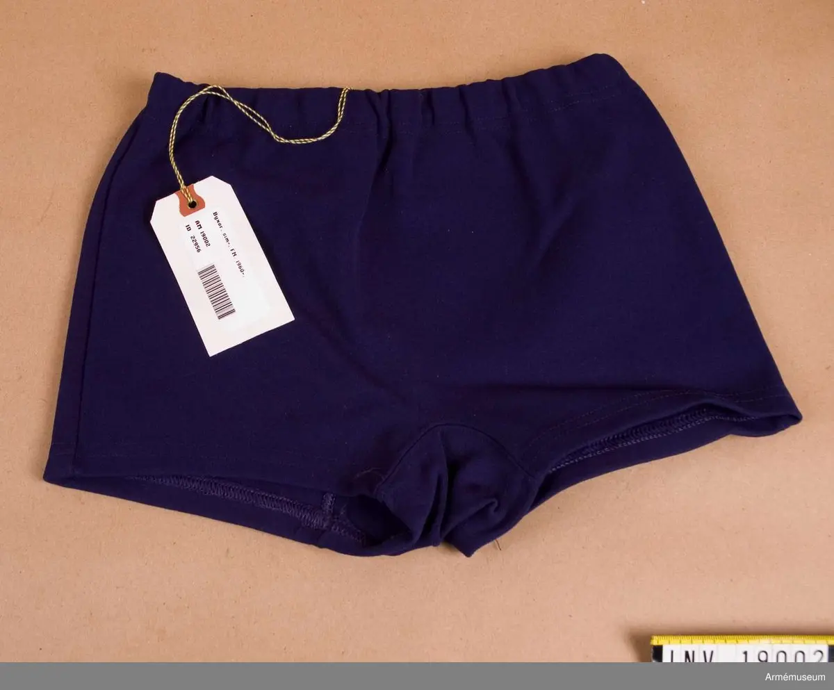 Simbyxor, FN-tjänst.Tillverkade i stretchnylon i mörkblått nylongarn. Storlek 4. 100 % nylon.