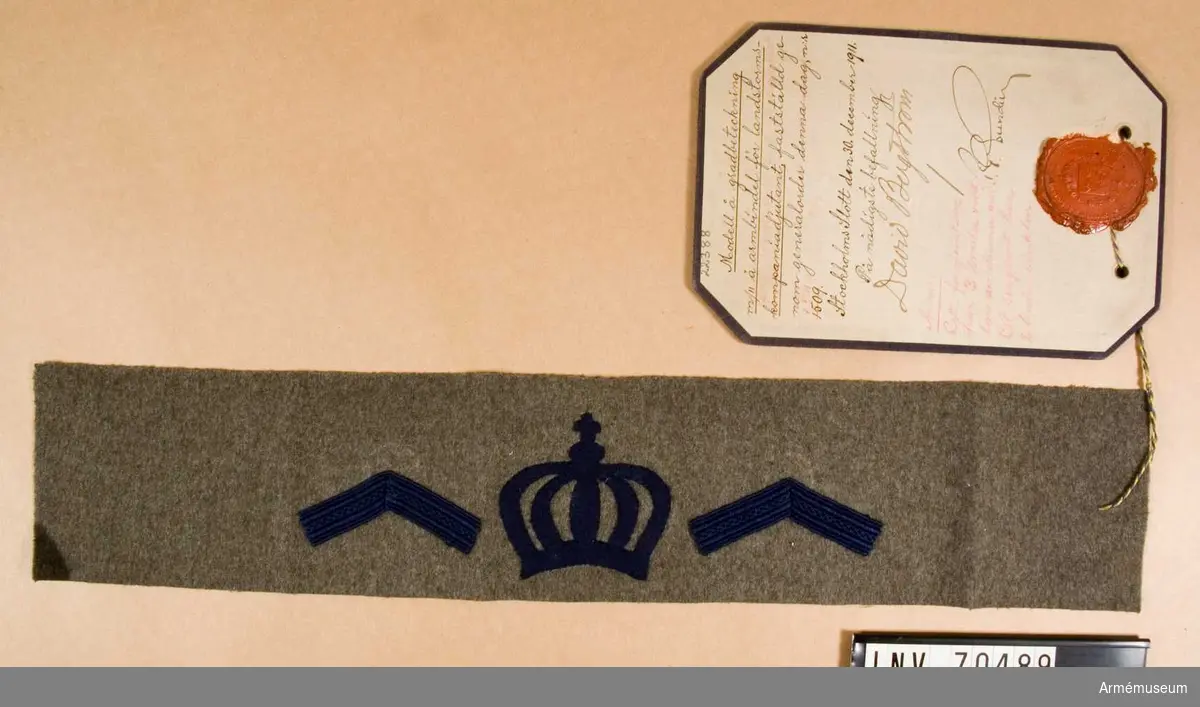 Grupp C.I. I
Modell på gradbeteckning m/1911 på armbindel för landstormsfanjunkare och landstormssergeant, fastställd genom generalorder nr 1540 den 6. juli 1935. 