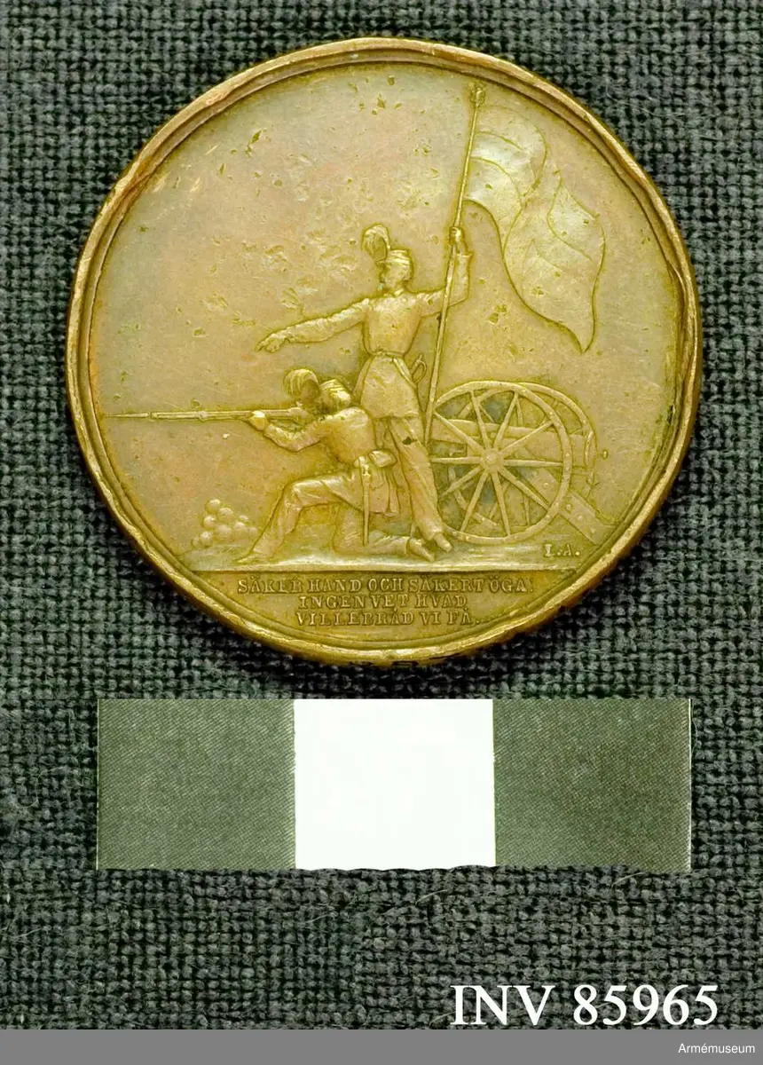 Grupp M..
Åtidan: Lika med nr: 16267.
Frånsidan: Lika med nr: 16267 med undantag att intet namn är inristat å medaljen.
