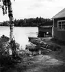 Uppland, Stockholms län, Frötuna skeppslag, Länna socken, Högmarsö. Ernst Karlssons strandställe med båtlänne, sjöbod och båtbyggnadsskjul.