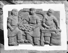 Relief med bagare av skulptören William Marklund