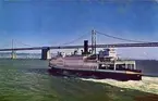 C788-Ferry Boat and Bay Bridge. Once the only means of crossing San francisco Bay, the ferries now have been supplanted by ther San Francisco-Oakland Bridge[....]Bay area traffic.