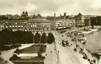 Stockholm, Kungsträdgården och Blasieholmshamnen från väster med Grand Hotel i bakgrunden. Vykort.