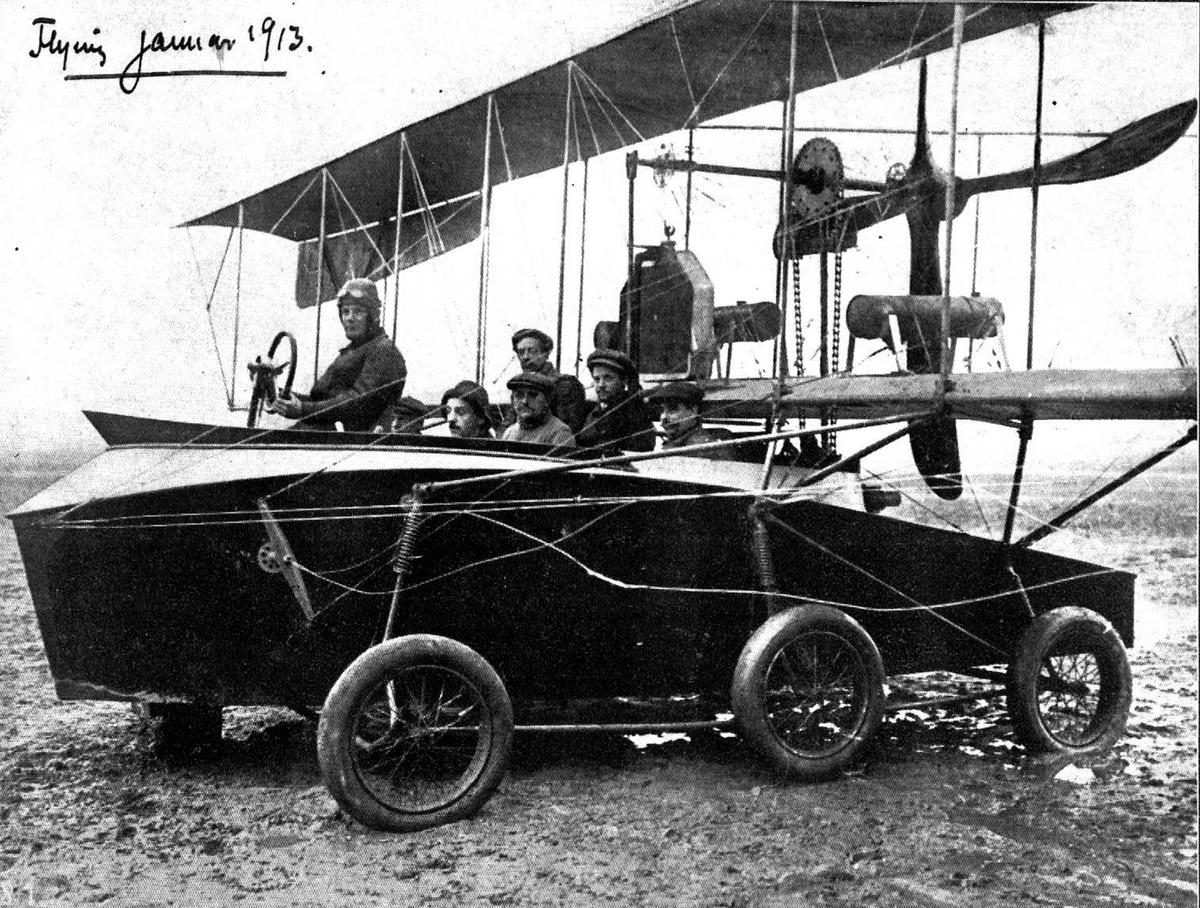 Utklipp. Ett fly på bakken, Voisin Hydro-Aerobus. Seks personer i flyet.