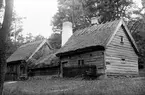 Ryggåsstugan i Jönköpings stadspark, flyttad från Sjöaryds by, Markaryds socken, Sunnerbo härad.