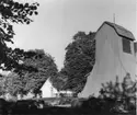 Holms Kyrka, klockstapel och del av kyrkogård.