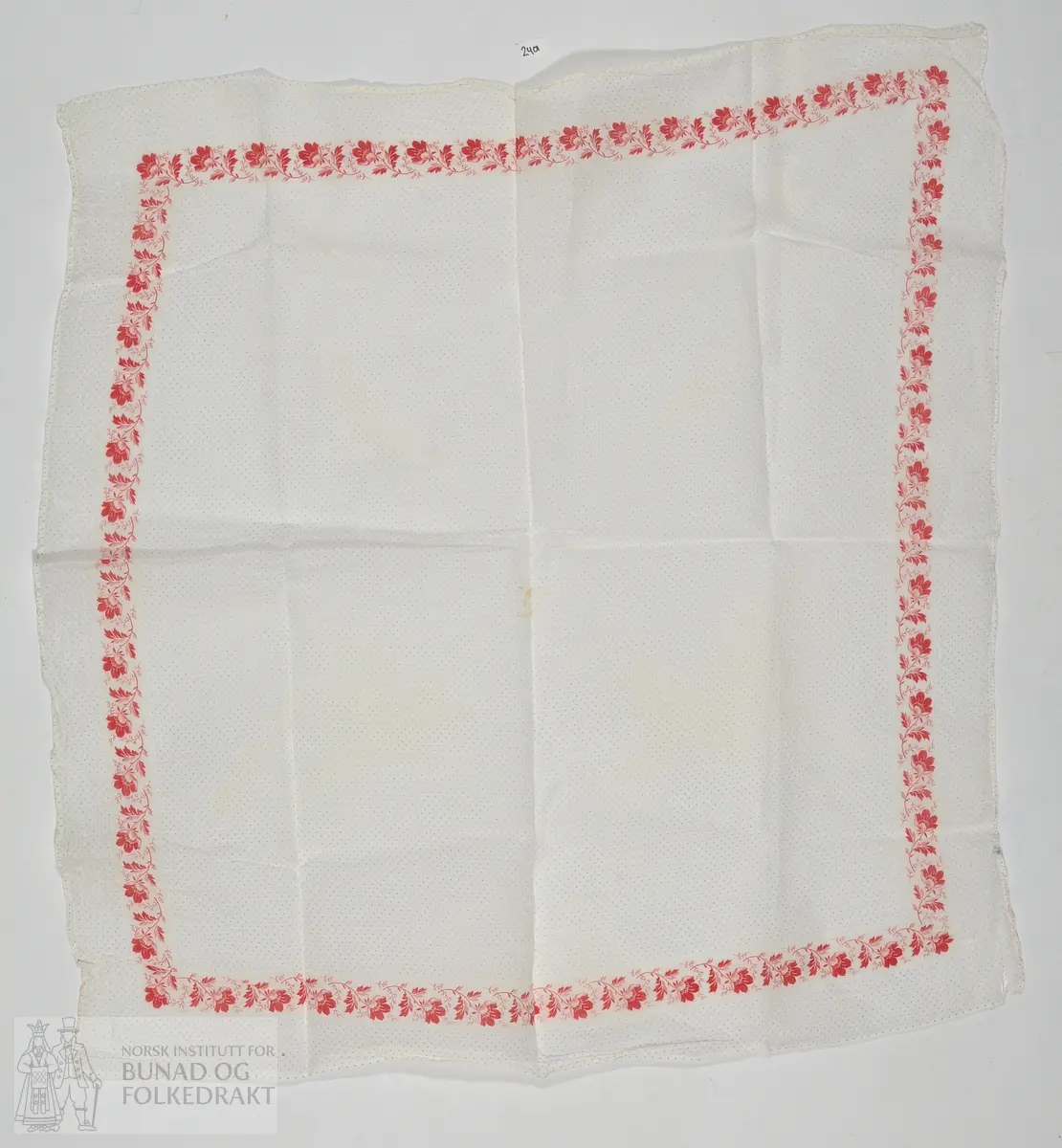 Stivatørkle i bomull med blåe prikkar og raud blomsterbord. 70x70cm