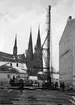 Uppsala stadsbibliotek och Centralbadets simhall under uppförande, Östra Ågatan, Uppsala mars 1940