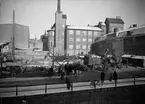 Uppsala stadsbibliotek och Centralbadets simhall under uppförande, Östra Ågatan, Uppsala mars 1940