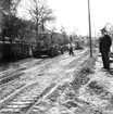 Vägbreddning och ny väg byggs till Bergsgatan och Norra Parkgatan i Huskvarna den 24 maj 1956.