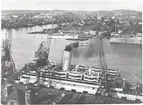 Foto från Sjömanstornet i Göteborgs hamn den 24 mars 1946.
Amerikakajen, Stigbergskajen med S/S Drottningholm i förgrunden samt i bakgrunden från vänster till höger, M/S Kronprinsessan Ingrid, Färjan 7 samt S/S Stavangerfjord.