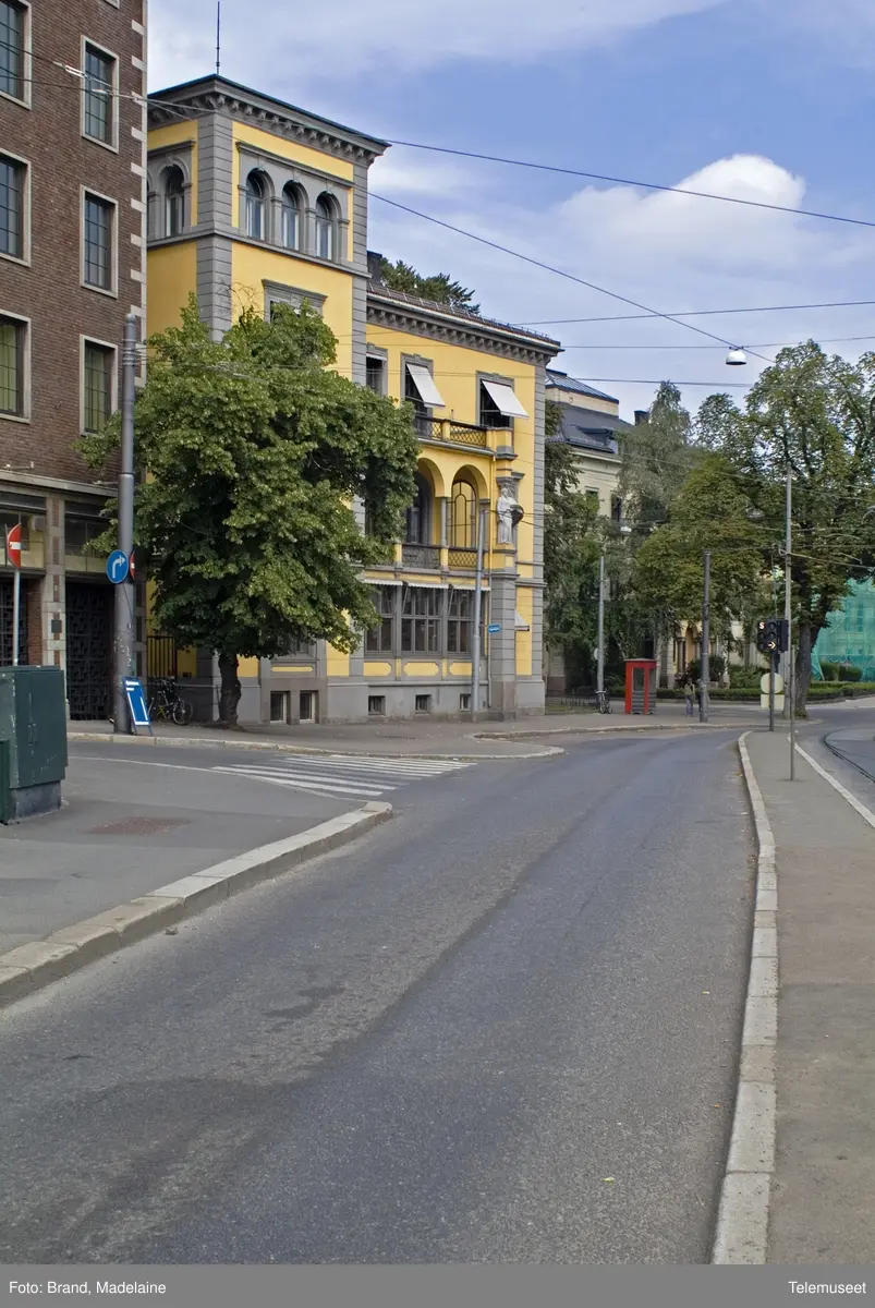 This is the story of how Norway’s most important conversation-space was designed by a young, freshly graduated man from Bergen.

“Norwegian architects are hereby invited…”
In the autumn of 1932, Oslo Telefonanlegginitiated an architectural competition. Finally, Oslo would get its own telephone booth. The city had had so called “talking-stations” from 1885, which in turn were overtaken by automatic telephones 
 only available at selected Narvesen kiosks. The state 
was of the opinion that now was the time to offer the public a better service; public telephone booths open 24/7, like the ones they already had in Sweden and England. But what would they look like, these new telephone booths? What considerations would it
 be necessary to take when designing it? The telegraph board developed a detailed list of demands and restraints: “The booth is intended to be placed outside on the streets and squares and need to be designed so that snow and ice does not hinder the opening and closing of the doors,” they wrote. “To prevent vandalism, theft, uncleanliness etc. inside the booth, it needs to be designed so that from all angles one may see what is going on in there.” Additionally, it would need to withstand storms and bad weather, and “preferably also being whipped by rain mixed with seawater” 

This was not all: The appearance would have to be «pleasing». The booth also needed to be movable, so that it could be taken in to be serviced at Telegrafverket’s main workshops. The reqired material was iron, and the surface was to be spray painted  preferably using car-body paint. There was a requirement for “a writing shelf, a pack shelf, and a suitable place for the telephone catalogue.” Also, there would need to be an illuminated TELEFON  sign, easily visible from all four angles. The total cost for each booth should not exceed 1000 kroner. The first prize for coming up with such a product was 800 kroner.

“Norwegianarchitects are hereby invited to partake in a competition for the design of a telephone booth…”  

The man with the solution
«At some point in 1932, Georg Fredrik sat at a party in Bergen. Maybe he felt a bit lost and forgotten as he often had throughout his life. He retreated to a quiet corner, took out a pencil and strted doodling on a matchbox.  According to my mother, this was how the telephone booth came into being.” In the book “Norges lille røde  historien om telefonkiosken,” Lars Fasting describes his father, the man who is far less known than the iconic architctural structure he left behind. Georg Fredrik Fasting was from Bergen, born into a family of working people and smallholders. One unusual facet of Georg Fredrik was that he was born without ears. His mother made sure he learnt to speak, read and write, 
ut Lars Fasting indicates that his father would seek refuge in drawing when the social challenges became too much to bear. And in the end drawing became his profession. In 1924 he secured a guarantor for a student loan, and started studying to become an a
rchitect at the NTH. Throughout the 1930s he entered several architectural competitions, with drafts produced, according to his son, “after work and in the late hours of the night.”

His efforts were not wasted. Out of 93 entries, with names such as “Flirt”, “Brrr”, “Ring” and “Amor”, the jury selected Fasting’s submission, “RIKS” as the new telephone booth: “The draft shows a strikingly simple solution to the task, technically as well as aesthetically well worked out.”

Taut and provident
Simple and aesthetc are the keywords here. Fasting had designed a booth pointing towards the future, and to modernism. Just how modern it was can be seen by comparing RIKS to the British telephone booth, also designed in the interwar-era. While the British version with it classicistic style is looking back to the heyday of the empire, Fasting’s booth is progressive and functionalistic. Like most Norwegian architects, Fasting broke with the classicistic style of architecture after the Stockholm-exhibition in 1930. “After it, almost all buildings erected in Norway until the German invasion in 1940, were in the functionalistic architectural style,” writes senior curator of architecture at the Norwegian National Museum, Ulf Grønvold, in the book, “Den lille røde”.“TheNorwegian booth is a piece of functionalistic architecture, an asymmetric composition with its roof slab overhanging the word TELEFON, in bold sans seraph lettering,”concludes Ulf Grønvold.

Fashionably red
And it was red. Fasting chose a colour which was part of the modern palette. “A bright red colour, but not as shiny as a signal red, the character of the colour places it among the fashionable colours within functionalism,” states paintings conservator and researcher in NIKU (Norwegian Institute for Cultural Heitage Research), Jon Brænne. In his opinion, Fasting went for visibility without making the booth stand out too much from its surroundings. The original colour was in use up to around 1950, when it changed to signal red. Towards the end of the 1970s the clour was again adjusted towards today’s orangey red.

The design, however, has not changed. RIKS is eighty years and still looks remarkably good. That’s what makes Fasting’s telephone booth a classic  even before it was added to DOCOMOMO’s list over moden icons of design. For Telenor, the telephone booth has served as a pathway into the hearts of the public. For many, Telenor (Televerket) was synonymous with exactly this telephone booth, because this was where one would go to place a call. Having a home
phone was not common until the 1980s. As such the red box became part of the Norwegian everyday and consciousness. The symbol- and publicity value of this is hard to evaluate, but in 2007 it was time to give honour where honour was due, Telenor, in consul
tation with the Directorate for Cultural Heritage, decided to preserve 100 telephone booths for all eternity.

And what about Georg Fredrik Fasting? What happened to him? At the age of 56 an entry in his diary states: «I CAN HEAR». As the first person in th world he had undergone an operation where he had ear canals constructed and eardrums fitted. For the rest of his life, the man behind Norway’s own telephone booth could answer the telephone himself.

Source: Norges lille røde historien om telefonkiosken (2007), issued by The Norwegian Telecom Museum and Telenor Cultural Heritage.