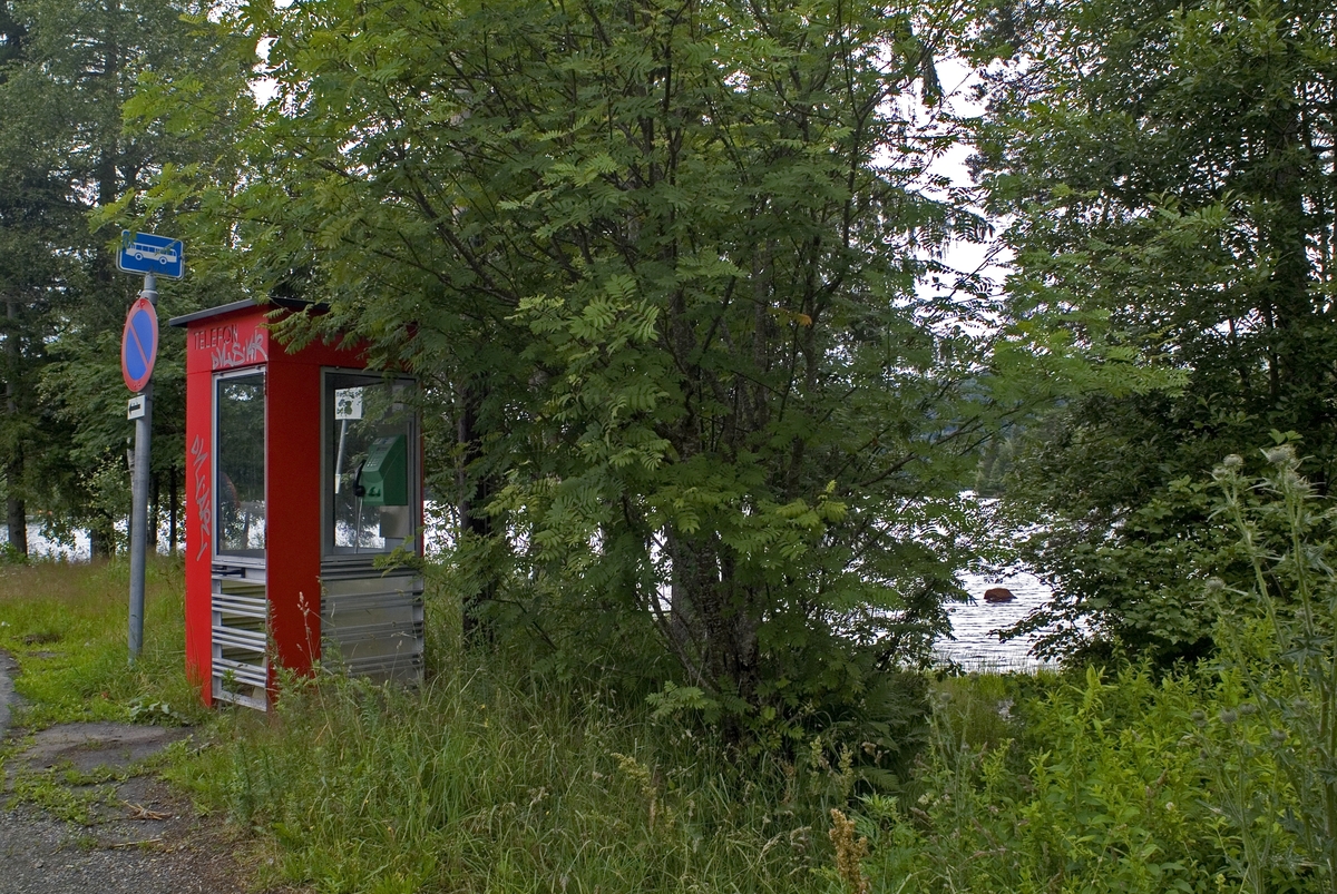 This is the story of how Norway’s most important conversation-space was designed by a young, freshly graduated man from Bergen.

“Norwegian architects are hereby invited…”
In the autumn of 1932, Oslo Telefonanlegginitiated an architectural competition. Finally, Oslo would get its own telephone booth. The city had had so called “talking-stations” from 1885, which in turn were overtaken by automatic telephones 
 only available at selected Narvesen kiosks. The state 
was of the opinion that now was the time to offer the public a better service; public telephone booths open 24/7, like the ones they already had in Sweden and England. But what would they look like, these new telephone booths? What considerations would it
 be necessary to take when designing it? The telegraph board developed a detailed list of demands and restraints: “The booth is intended to be placed outside on the streets and squares and need to be designed so that snow and ice does not hinder the opening and closing of the doors,” they wrote. “To prevent vandalism, theft, uncleanliness etc. inside the booth, it needs to be designed so that from all angles one may see what is going on in there.” Additionally, it would need to withstand storms and bad weather, and “preferably also being whipped by rain mixed with seawater” 

This was not all: The appearance would have to be «pleasing». The booth also needed to be movable, so that it could be taken in to be serviced at Telegrafverket’s main workshops. The reqired material was iron, and the surface was to be spray painted  preferably using car-body paint. There was a requirement for “a writing shelf, a pack shelf, and a suitable place for the telephone catalogue.” Also, there would need to be an illuminated TELEFON  sign, easily visible from all four angles. The total cost for each booth should not exceed 1000 kroner. The first prize for coming up with such a product was 800 kroner.

“Norwegianarchitects are hereby invited to partake in a competition for the design of a telephone booth…”  

The man with the solution
«At some point in 1932, Georg Fredrik sat at a party in Bergen. Maybe he felt a bit lost and forgotten as he often had throughout his life. He retreated to a quiet corner, took out a pencil and strted doodling on a matchbox.  According to my mother, this was how the telephone booth came into being.” In the book “Norges lille røde  historien om telefonkiosken,” Lars Fasting describes his father, the man who is far less known than the iconic architctural structure he left behind. Georg Fredrik Fasting was from Bergen, born into a family of working people and smallholders. One unusual facet of Georg Fredrik was that he was born without ears. His mother made sure he learnt to speak, read and write, 
ut Lars Fasting indicates that his father would seek refuge in drawing when the social challenges became too much to bear. And in the end drawing became his profession. In 1924 he secured a guarantor for a student loan, and started studying to become an a
rchitect at the NTH. Throughout the 1930s he entered several architectural competitions, with drafts produced, according to his son, “after work and in the late hours of the night.”

His efforts were not wasted. Out of 93 entries, with names such as “Flirt”, “Brrr”, “Ring” and “Amor”, the jury selected Fasting’s submission, “RIKS” as the new telephone booth: “The draft shows a strikingly simple solution to the task, technically as well as aesthetically well worked out.”

Taut and provident
Simple and aesthetc are the keywords here. Fasting had designed a booth pointing towards the future, and to modernism. Just how modern it was can be seen by comparing RIKS to the British telephone booth, also designed in the interwar-era. While the British version with it classicistic style is looking back to the heyday of the empire, Fasting’s booth is progressive and functionalistic. Like most Norwegian architects, Fasting broke with the classicistic style of architecture after the Stockholm-exhibition in 1930. “After it, almost all buildings erected in Norway until the German invasion in 1940, were in the functionalistic architectural style,” writes senior curator of architecture at the Norwegian National Museum, Ulf Grønvold, in the book, “Den lille røde”.“TheNorwegian booth is a piece of functionalistic architecture, an asymmetric composition with its roof slab overhanging the word TELEFON, in bold sans seraph lettering,”concludes Ulf Grønvold.

Fashionably red
And it was red. Fasting chose a colour which was part of the modern palette. “A bright red colour, but not as shiny as a signal red, the character of the colour places it among the fashionable colours within functionalism,” states paintings conservator and researcher in NIKU (Norwegian Institute for Cultural Heitage Research), Jon Brænne. In his opinion, Fasting went for visibility without making the booth stand out too much from its surroundings. The original colour was in use up to around 1950, when it changed to signal red. Towards the end of the 1970s the clour was again adjusted towards today’s orangey red.

The design, however, has not changed. RIKS is eighty years and still looks remarkably good. That’s what makes Fasting’s telephone booth a classic  even before it was added to DOCOMOMO’s list over moden icons of design. For Telenor, the telephone booth has served as a pathway into the hearts of the public. For many, Telenor (Televerket) was synonymous with exactly this telephone booth, because this was where one would go to place a call. Having a home
phone was not common until the 1980s. As such the red box became part of the Norwegian everyday and consciousness. The symbol- and publicity value of this is hard to evaluate, but in 2007 it was time to give honour where honour was due, Telenor, in consul
tation with the Directorate for Cultural Heritage, decided to preserve 100 telephone booths for all eternity.

And what about Georg Fredrik Fasting? What happened to him? At the age of 56 an entry in his diary states: «I CAN HEAR». As the first person in th world he had undergone an operation where he had ear canals constructed and eardrums fitted. For the rest of his life, the man behind Norway’s own telephone booth could answer the telephone himself.

Source: Norges lille røde historien om telefonkiosken (2007), issued by The Norwegian Telecom Museum and Telenor Cultural Heritage.