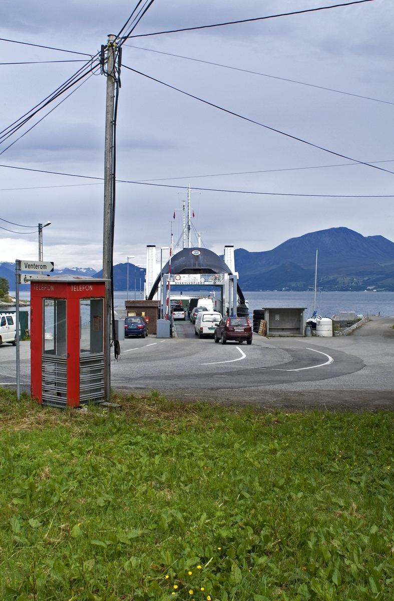 This is the story of how Norway’s most important conversation-space was designed by a young, freshly graduated man from Bergen.

“Norwegian architects are hereby invited…”
In the autumn of 1932, Oslo Telefonanlegginitiated an architectural competition. Finally, Oslo would get its own telephone booth. The city had had so called “talking-stations” from 1885, which in turn were overtaken by automatic telephones 
 only available at selected Narvesen kiosks. The state 
was of the opinion that now was the time to offer the public a better service; public telephone booths open 24/7, like the ones they already had in Sweden and England. But what would they look like, these new telephone booths? What considerations would it
 be necessary to take when designing it? The telegraph board developed a detailed list of demands and restraints: “The booth is intended to be placed outside on the streets and squares and need to be designed so that snow and ice does not hinder the opening and closing of the doors,” they wrote. “To prevent vandalism, theft, uncleanliness etc. inside the booth, it needs to be designed so that from all angles one may see what is going on in there.” Additionally, it would need to withstand storms and bad weather, and “preferably also being whipped by rain mixed with seawater” 

This was not all: The appearance would have to be «pleasing». The booth also needed to be movable, so that it could be taken in to be serviced at Telegrafverket’s main workshops. The reqired material was iron, and the surface was to be spray painted  preferably using car-body paint. There was a requirement for “a writing shelf, a pack shelf, and a suitable place for the telephone catalogue.” Also, there would need to be an illuminated TELEFON  sign, easily visible from all four angles. The total cost for each booth should not exceed 1000 kroner. The first prize for coming up with such a product was 800 kroner.

“Norwegianarchitects are hereby invited to partake in a competition for the design of a telephone booth…”  

The man with the solution
«At some point in 1932, Georg Fredrik sat at a party in Bergen. Maybe he felt a bit lost and forgotten as he often had throughout his life. He retreated to a quiet corner, took out a pencil and strted doodling on a matchbox.  According to my mother, this was how the telephone booth came into being.” In the book “Norges lille røde  historien om telefonkiosken,” Lars Fasting describes his father, the man who is far less known than the iconic architctural structure he left behind. Georg Fredrik Fasting was from Bergen, born into a family of working people and smallholders. One unusual facet of Georg Fredrik was that he was born without ears. His mother made sure he learnt to speak, read and write, 
ut Lars Fasting indicates that his father would seek refuge in drawing when the social challenges became too much to bear. And in the end drawing became his profession. In 1924 he secured a guarantor for a student loan, and started studying to become an a
rchitect at the NTH. Throughout the 1930s he entered several architectural competitions, with drafts produced, according to his son, “after work and in the late hours of the night.”

His efforts were not wasted. Out of 93 entries, with names such as “Flirt”, “Brrr”, “Ring” and “Amor”, the jury selected Fasting’s submission, “RIKS” as the new telephone booth: “The draft shows a strikingly simple solution to the task, technically as well as aesthetically well worked out.”

Taut and provident
Simple and aesthetc are the keywords here. Fasting had designed a booth pointing towards the future, and to modernism. Just how modern it was can be seen by comparing RIKS to the British telephone booth, also designed in the interwar-era. While the British version with it classicistic style is looking back to the heyday of the empire, Fasting’s booth is progressive and functionalistic. Like most Norwegian architects, Fasting broke with the classicistic style of architecture after the Stockholm-exhibition in 1930. “After it, almost all buildings erected in Norway until the German invasion in 1940, were in the functionalistic architectural style,” writes senior curator of architecture at the Norwegian National Museum, Ulf Grønvold, in the book, “Den lille røde”.“TheNorwegian booth is a piece of functionalistic architecture, an asymmetric composition with its roof slab overhanging the word TELEFON, in bold sans seraph lettering,”concludes Ulf Grønvold.

Fashionably red
And it was red. Fasting chose a colour which was part of the modern palette. “A bright red colour, but not as shiny as a signal red, the character of the colour places it among the fashionable colours within functionalism,” states paintings conservator and researcher in NIKU (Norwegian Institute for Cultural Heitage Research), Jon Brænne. In his opinion, Fasting went for visibility without making the booth stand out too much from its surroundings. The original colour was in use up to around 1950, when it changed to signal red. Towards the end of the 1970s the clour was again adjusted towards today’s orangey red.

The design, however, has not changed. RIKS is eighty years and still looks remarkably good. That’s what makes Fasting’s telephone booth a classic  even before it was added to DOCOMOMO’s list over moden icons of design. For Telenor, the telephone booth has served as a pathway into the hearts of the public. For many, Telenor (Televerket) was synonymous with exactly this telephone booth, because this was where one would go to place a call. Having a home
phone was not common until the 1980s. As such the red box became part of the Norwegian everyday and consciousness. The symbol- and publicity value of this is hard to evaluate, but in 2007 it was time to give honour where honour was due, Telenor, in consul
tation with the Directorate for Cultural Heritage, decided to preserve 100 telephone booths for all eternity.

And what about Georg Fredrik Fasting? What happened to him? At the age of 56 an entry in his diary states: «I CAN HEAR». As the first person in th world he had undergone an operation where he had ear canals constructed and eardrums fitted. For the rest of his life, the man behind Norway’s own telephone booth could answer the telephone himself.

Source: Norges lille røde historien om telefonkiosken (2007), issued by The Norwegian Telecom Museum and Telenor Cultural Heritage.