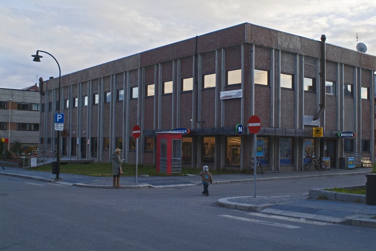 This is the story of how Norway’s most important conversation-space was designed by a young, freshly graduated man from Bergen.

“Norwegian architects are hereby invited…”
In the autumn of 1932, Oslo Telefonanlegginitiated an architectural competition. Finally, Oslo would get its own telephone booth. The city had had so called “talking-stations” from 1885, which in turn were overtaken by automatic telephones 
 only available at selected Narvesen kiosks. The state 
was of the opinion that now was the time to offer the public a better service; public telephone booths open 24/7, like the ones they already had in Sweden and England. But what would they look like, these new telephone booths? What considerations would it
 be necessary to take when designing it? The telegraph board developed a detailed list of demands and restraints: “The booth is intended to be placed outside on the streets and squares and need to be designed so that snow and ice does not hinder the opening and closing of the doors,” they wrote. “To prevent vandalism, theft, uncleanliness etc. inside the booth, it needs to be designed so that from all angles one may see what is going on in there.” Additionally, it would need to withstand storms and bad weather, and “preferably also being whipped by rain mixed with seawater” 

This was not all: The appearance would have to be «pleasing». The booth also needed to be movable, so that it could be taken in to be serviced at Telegrafverket’s main workshops. The reqired material was iron, and the surface was to be spray painted  preferably using car-body paint. There was a requirement for “a writing shelf, a pack shelf, and a suitable place for the telephone catalogue.” Also, there would need to be an illuminated TELEFON  sign, easily visible from all four angles. The total cost for each booth should not exceed 1000 kroner. The first prize for coming up with such a product was 800 kroner.

“Norwegianarchitects are hereby invited to partake in a competition for the design of a telephone booth…”  

The man with the solution
«At some point in 1932, Georg Fredrik sat at a party in Bergen. Maybe he felt a bit lost and forgotten as he often had throughout his life. He retreated to a quiet corner, took out a pencil and strted doodling on a matchbox.  According to my mother, this was how the telephone booth came into being.” In the book “Norges lille røde  historien om telefonkiosken,” Lars Fasting describes his father, the man who is far less known than the iconic architctural structure he left behind. Georg Fredrik Fasting was from Bergen, born into a family of working people and smallholders. One unusual facet of Georg Fredrik was that he was born without ears. His mother made sure he learnt to speak, read and write, 
ut Lars Fasting indicates that his father would seek refuge in drawing when the social challenges became too much to bear. And in the end drawing became his profession. In 1924 he secured a guarantor for a student loan, and started studying to become an a
rchitect at the NTH. Throughout the 1930s he entered several architectural competitions, with drafts produced, according to his son, “after work and in the late hours of the night.”

His efforts were not wasted. Out of 93 entries, with names such as “Flirt”, “Brrr”, “Ring” and “Amor”, the jury selected Fasting’s submission, “RIKS” as the new telephone booth: “The draft shows a strikingly simple solution to the task, technically as well as aesthetically well worked out.”

Taut and provident
Simple and aesthetc are the keywords here. Fasting had designed a booth pointing towards the future, and to modernism. Just how modern it was can be seen by comparing RIKS to the British telephone booth, also designed in the interwar-era. While the British version with it classicistic style is looking back to the heyday of the empire, Fasting’s booth is progressive and functionalistic. Like most Norwegian architects, Fasting broke with the classicistic style of architecture after the Stockholm-exhibition in 1930. “After it, almost all buildings erected in Norway until the German invasion in 1940, were in the functionalistic architectural style,” writes senior curator of architecture at the Norwegian National Museum, Ulf Grønvold, in the book, “Den lille røde”.“TheNorwegian booth is a piece of functionalistic architecture, an asymmetric composition with its roof slab overhanging the word TELEFON, in bold sans seraph lettering,”concludes Ulf Grønvold.

Fashionably red
And it was red. Fasting chose a colour which was part of the modern palette. “A bright red colour, but not as shiny as a signal red, the character of the colour places it among the fashionable colours within functionalism,” states paintings conservator and researcher in NIKU (Norwegian Institute for Cultural Heitage Research), Jon Brænne. In his opinion, Fasting went for visibility without making the booth stand out too much from its surroundings. The original colour was in use up to around 1950, when it changed to signal red. Towards the end of the 1970s the clour was again adjusted towards today’s orangey red.

The design, however, has not changed. RIKS is eighty years and still looks remarkably good. That’s what makes Fasting’s telephone booth a classic  even before it was added to DOCOMOMO’s list over moden icons of design. For Telenor, the telephone booth has served as a pathway into the hearts of the public. For many, Telenor (Televerket) was synonymous with exactly this telephone booth, because this was where one would go to place a call. Having a home
phone was not common until the 1980s. As such the red box became part of the Norwegian everyday and consciousness. The symbol- and publicity value of this is hard to evaluate, but in 2007 it was time to give honour where honour was due, Telenor, in consul
tation with the Directorate for Cultural Heritage, decided to preserve 100 telephone booths for all eternity.

And what about Georg Fredrik Fasting? What happened to him? At the age of 56 an entry in his diary states: «I CAN HEAR». As the first person in th world he had undergone an operation where he had ear canals constructed and eardrums fitted. For the rest of his life, the man behind Norway’s own telephone booth could answer the telephone himself.

Source: Norges lille røde historien om telefonkiosken (2007), issued by The Norwegian Telecom Museum and Telenor Cultural Heritage.
