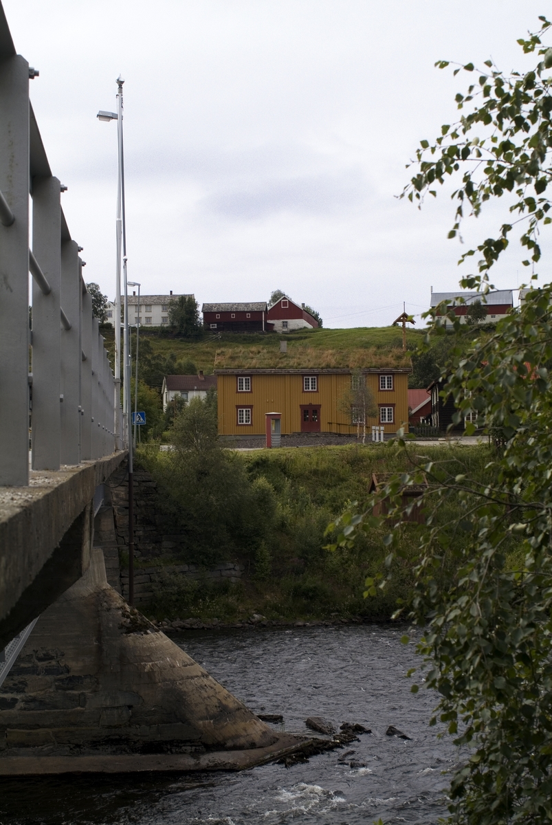 This is the story of how Norway’s most important conversation-space was designed by a young, freshly graduated man from Bergen.

“Norwegian architects are hereby invited…”
In the autumn of 1932, Oslo Telefonanlegginitiated an architectural competition. Finally, Oslo would get its own telephone booth. The city had had so called “talking-stations” from 1885, which in turn were overtaken by automatic telephones 
 only available at selected Narvesen kiosks. The state 
was of the opinion that now was the time to offer the public a better service; public telephone booths open 24/7, like the ones they already had in Sweden and England. But what would they look like, these new telephone booths? What considerations would it
 be necessary to take when designing it? The telegraph board developed a detailed list of demands and restraints: “The booth is intended to be placed outside on the streets and squares and need to be designed so that snow and ice does not hinder the opening and closing of the doors,” they wrote. “To prevent vandalism, theft, uncleanliness etc. inside the booth, it needs to be designed so that from all angles one may see what is going on in there.” Additionally, it would need to withstand storms and bad weather, and “preferably also being whipped by rain mixed with seawater” 

This was not all: The appearance would have to be «pleasing». The booth also needed to be movable, so that it could be taken in to be serviced at Telegrafverket’s main workshops. The reqired material was iron, and the surface was to be spray painted  preferably using car-body paint. There was a requirement for “a writing shelf, a pack shelf, and a suitable place for the telephone catalogue.” Also, there would need to be an illuminated TELEFON  sign, easily visible from all four angles. The total cost for each booth should not exceed 1000 kroner. The first prize for coming up with such a product was 800 kroner.

“Norwegianarchitects are hereby invited to partake in a competition for the design of a telephone booth…”  

The man with the solution
«At some point in 1932, Georg Fredrik sat at a party in Bergen. Maybe he felt a bit lost and forgotten as he often had throughout his life. He retreated to a quiet corner, took out a pencil and strted doodling on a matchbox.  According to my mother, this was how the telephone booth came into being.” In the book “Norges lille røde  historien om telefonkiosken,” Lars Fasting describes his father, the man who is far less known than the iconic architctural structure he left behind. Georg Fredrik Fasting was from Bergen, born into a family of working people and smallholders. One unusual facet of Georg Fredrik was that he was born without ears. His mother made sure he learnt to speak, read and write, 
ut Lars Fasting indicates that his father would seek refuge in drawing when the social challenges became too much to bear. And in the end drawing became his profession. In 1924 he secured a guarantor for a student loan, and started studying to become an a
rchitect at the NTH. Throughout the 1930s he entered several architectural competitions, with drafts produced, according to his son, “after work and in the late hours of the night.”

His efforts were not wasted. Out of 93 entries, with names such as “Flirt”, “Brrr”, “Ring” and “Amor”, the jury selected Fasting’s submission, “RIKS” as the new telephone booth: “The draft shows a strikingly simple solution to the task, technically as well as aesthetically well worked out.”

Taut and provident
Simple and aesthetc are the keywords here. Fasting had designed a booth pointing towards the future, and to modernism. Just how modern it was can be seen by comparing RIKS to the British telephone booth, also designed in the interwar-era. While the British version with it classicistic style is looking back to the heyday of the empire, Fasting’s booth is progressive and functionalistic. Like most Norwegian architects, Fasting broke with the classicistic style of architecture after the Stockholm-exhibition in 1930. “After it, almost all buildings erected in Norway until the German invasion in 1940, were in the functionalistic architectural style,” writes senior curator of architecture at the Norwegian National Museum, Ulf Grønvold, in the book, “Den lille røde”.“TheNorwegian booth is a piece of functionalistic architecture, an asymmetric composition with its roof slab overhanging the word TELEFON, in bold sans seraph lettering,”concludes Ulf Grønvold.

Fashionably red
And it was red. Fasting chose a colour which was part of the modern palette. “A bright red colour, but not as shiny as a signal red, the character of the colour places it among the fashionable colours within functionalism,” states paintings conservator and researcher in NIKU (Norwegian Institute for Cultural Heitage Research), Jon Brænne. In his opinion, Fasting went for visibility without making the booth stand out too much from its surroundings. The original colour was in use up to around 1950, when it changed to signal red. Towards the end of the 1970s the clour was again adjusted towards today’s orangey red.

The design, however, has not changed. RIKS is eighty years and still looks remarkably good. That’s what makes Fasting’s telephone booth a classic  even before it was added to DOCOMOMO’s list over moden icons of design. For Telenor, the telephone booth has served as a pathway into the hearts of the public. For many, Telenor (Televerket) was synonymous with exactly this telephone booth, because this was where one would go to place a call. Having a home
phone was not common until the 1980s. As such the red box became part of the Norwegian everyday and consciousness. The symbol- and publicity value of this is hard to evaluate, but in 2007 it was time to give honour where honour was due, Telenor, in consul
tation with the Directorate for Cultural Heritage, decided to preserve 100 telephone booths for all eternity.

And what about Georg Fredrik Fasting? What happened to him? At the age of 56 an entry in his diary states: «I CAN HEAR». As the first person in th world he had undergone an operation where he had ear canals constructed and eardrums fitted. For the rest of his life, the man behind Norway’s own telephone booth could answer the telephone himself.

Source: Norges lille røde historien om telefonkiosken (2007), issued by The Norwegian Telecom Museum and Telenor Cultural Heritage.