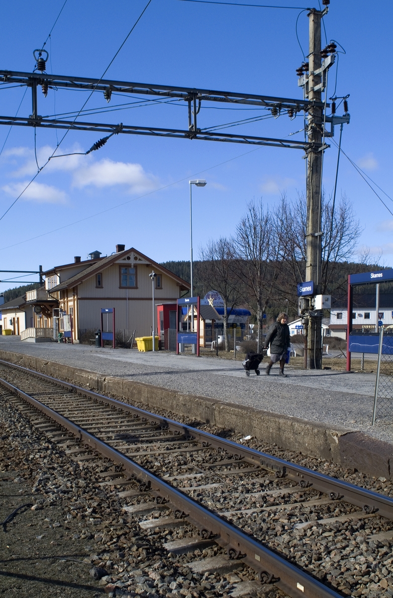 This is the story of how Norway’s most important conversation-space was designed by a young, freshly graduated man from Bergen.

“Norwegian architects are hereby invited…”
In the autumn of 1932, Oslo Telefonanlegginitiated an architectural competition. Finally, Oslo would get its own telephone booth. The city had had so called “talking-stations” from 1885, which in turn were overtaken by automatic telephones 
 only available at selected Narvesen kiosks. The state 
was of the opinion that now was the time to offer the public a better service; public telephone booths open 24/7, like the ones they already had in Sweden and England. But what would they look like, these new telephone booths? What considerations would it
 be necessary to take when designing it? The telegraph board developed a detailed list of demands and restraints: “The booth is intended to be placed outside on the streets and squares and need to be designed so that snow and ice does not hinder the opening and closing of the doors,” they wrote. “To prevent vandalism, theft, uncleanliness etc. inside the booth, it needs to be designed so that from all angles one may see what is going on in there.” Additionally, it would need to withstand storms and bad weather, and “preferably also being whipped by rain mixed with seawater” 

This was not all: The appearance would have to be «pleasing». The booth also needed to be movable, so that it could be taken in to be serviced at Telegrafverket’s main workshops. The reqired material was iron, and the surface was to be spray painted  preferably using car-body paint. There was a requirement for “a writing shelf, a pack shelf, and a suitable place for the telephone catalogue.” Also, there would need to be an illuminated TELEFON  sign, easily visible from all four angles. The total cost for each booth should not exceed 1000 kroner. The first prize for coming up with such a product was 800 kroner.

“Norwegianarchitects are hereby invited to partake in a competition for the design of a telephone booth…”  

The man with the solution
«At some point in 1932, Georg Fredrik sat at a party in Bergen. Maybe he felt a bit lost and forgotten as he often had throughout his life. He retreated to a quiet corner, took out a pencil and strted doodling on a matchbox.  According to my mother, this was how the telephone booth came into being.” In the book “Norges lille røde  historien om telefonkiosken,” Lars Fasting describes his father, the man who is far less known than the iconic architctural structure he left behind. Georg Fredrik Fasting was from Bergen, born into a family of working people and smallholders. One unusual facet of Georg Fredrik was that he was born without ears. His mother made sure he learnt to speak, read and write, 
ut Lars Fasting indicates that his father would seek refuge in drawing when the social challenges became too much to bear. And in the end drawing became his profession. In 1924 he secured a guarantor for a student loan, and started studying to become an a
rchitect at the NTH. Throughout the 1930s he entered several architectural competitions, with drafts produced, according to his son, “after work and in the late hours of the night.”

His efforts were not wasted. Out of 93 entries, with names such as “Flirt”, “Brrr”, “Ring” and “Amor”, the jury selected Fasting’s submission, “RIKS” as the new telephone booth: “The draft shows a strikingly simple solution to the task, technically as well as aesthetically well worked out.”

Taut and provident
Simple and aesthetc are the keywords here. Fasting had designed a booth pointing towards the future, and to modernism. Just how modern it was can be seen by comparing RIKS to the British telephone booth, also designed in the interwar-era. While the British version with it classicistic style is looking back to the heyday of the empire, Fasting’s booth is progressive and functionalistic. Like most Norwegian architects, Fasting broke with the classicistic style of architecture after the Stockholm-exhibition in 1930. “After it, almost all buildings erected in Norway until the German invasion in 1940, were in the functionalistic architectural style,” writes senior curator of architecture at the Norwegian National Museum, Ulf Grønvold, in the book, “Den lille røde”.“TheNorwegian booth is a piece of functionalistic architecture, an asymmetric composition with its roof slab overhanging the word TELEFON, in bold sans seraph lettering,”concludes Ulf Grønvold.

Fashionably red
And it was red. Fasting chose a colour which was part of the modern palette. “A bright red colour, but not as shiny as a signal red, the character of the colour places it among the fashionable colours within functionalism,” states paintings conservator and researcher in NIKU (Norwegian Institute for Cultural Heitage Research), Jon Brænne. In his opinion, Fasting went for visibility without making the booth stand out too much from its surroundings. The original colour was in use up to around 1950, when it changed to signal red. Towards the end of the 1970s the clour was again adjusted towards today’s orangey red.

The design, however, has not changed. RIKS is eighty years and still looks remarkably good. That’s what makes Fasting’s telephone booth a classic  even before it was added to DOCOMOMO’s list over moden icons of design. For Telenor, the telephone booth has served as a pathway into the hearts of the public. For many, Telenor (Televerket) was synonymous with exactly this telephone booth, because this was where one would go to place a call. Having a home
phone was not common until the 1980s. As such the red box became part of the Norwegian everyday and consciousness. The symbol- and publicity value of this is hard to evaluate, but in 2007 it was time to give honour where honour was due, Telenor, in consul
tation with the Directorate for Cultural Heritage, decided to preserve 100 telephone booths for all eternity.

And what about Georg Fredrik Fasting? What happened to him? At the age of 56 an entry in his diary states: «I CAN HEAR». As the first person in th world he had undergone an operation where he had ear canals constructed and eardrums fitted. For the rest of his life, the man behind Norway’s own telephone booth could answer the telephone himself.

Source: Norges lille røde historien om telefonkiosken (2007), issued by The Norwegian Telecom Museum and Telenor Cultural Heritage.