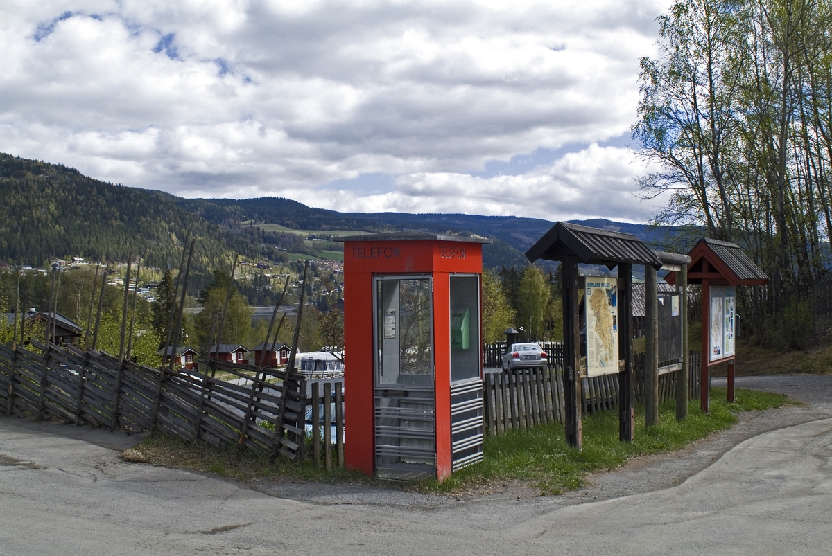 This is the story of how Norway’s most important conversation-space was designed by a young, freshly graduated man from Bergen.

“Norwegian architects are hereby invited…”
In the autumn of 1932, Oslo Telefonanlegginitiated an architectural competition. Finally, Oslo would get its own telephone booth. The city had had so called “talking-stations” from 1885, which in turn were overtaken by automatic telephones 
 only available at selected Narvesen kiosks. The state 
was of the opinion that now was the time to offer the public a better service; public telephone booths open 24/7, like the ones they already had in Sweden and England. But what would they look like, these new telephone booths? What considerations would it
 be necessary to take when designing it? The telegraph board developed a detailed list of demands and restraints: “The booth is intended to be placed outside on the streets and squares and need to be designed so that snow and ice does not hinder the opening and closing of the doors,” they wrote. “To prevent vandalism, theft, uncleanliness etc. inside the booth, it needs to be designed so that from all angles one may see what is going on in there.” Additionally, it would need to withstand storms and bad weather, and “preferably also being whipped by rain mixed with seawater” 

This was not all: The appearance would have to be «pleasing». The booth also needed to be movable, so that it could be taken in to be serviced at Telegrafverket’s main workshops. The reqired material was iron, and the surface was to be spray painted  preferably using car-body paint. There was a requirement for “a writing shelf, a pack shelf, and a suitable place for the telephone catalogue.” Also, there would need to be an illuminated TELEFON  sign, easily visible from all four angles. The total cost for each booth should not exceed 1000 kroner. The first prize for coming up with such a product was 800 kroner.

“Norwegianarchitects are hereby invited to partake in a competition for the design of a telephone booth…”  

The man with the solution
«At some point in 1932, Georg Fredrik sat at a party in Bergen. Maybe he felt a bit lost and forgotten as he often had throughout his life. He retreated to a quiet corner, took out a pencil and strted doodling on a matchbox.  According to my mother, this was how the telephone booth came into being.” In the book “Norges lille røde  historien om telefonkiosken,” Lars Fasting describes his father, the man who is far less known than the iconic architctural structure he left behind. Georg Fredrik Fasting was from Bergen, born into a family of working people and smallholders. One unusual facet of Georg Fredrik was that he was born without ears. His mother made sure he learnt to speak, read and write, 
ut Lars Fasting indicates that his father would seek refuge in drawing when the social challenges became too much to bear. And in the end drawing became his profession. In 1924 he secured a guarantor for a student loan, and started studying to become an a
rchitect at the NTH. Throughout the 1930s he entered several architectural competitions, with drafts produced, according to his son, “after work and in the late hours of the night.”

His efforts were not wasted. Out of 93 entries, with names such as “Flirt”, “Brrr”, “Ring” and “Amor”, the jury selected Fasting’s submission, “RIKS” as the new telephone booth: “The draft shows a strikingly simple solution to the task, technically as well as aesthetically well worked out.”

Taut and provident
Simple and aesthetc are the keywords here. Fasting had designed a booth pointing towards the future, and to modernism. Just how modern it was can be seen by comparing RIKS to the British telephone booth, also designed in the interwar-era. While the British version with it classicistic style is looking back to the heyday of the empire, Fasting’s booth is progressive and functionalistic. Like most Norwegian architects, Fasting broke with the classicistic style of architecture after the Stockholm-exhibition in 1930. “After it, almost all buildings erected in Norway until the German invasion in 1940, were in the functionalistic architectural style,” writes senior curator of architecture at the Norwegian National Museum, Ulf Grønvold, in the book, “Den lille røde”.“TheNorwegian booth is a piece of functionalistic architecture, an asymmetric composition with its roof slab overhanging the word TELEFON, in bold sans seraph lettering,”concludes Ulf Grønvold.

Fashionably red
And it was red. Fasting chose a colour which was part of the modern palette. “A bright red colour, but not as shiny as a signal red, the character of the colour places it among the fashionable colours within functionalism,” states paintings conservator and researcher in NIKU (Norwegian Institute for Cultural Heitage Research), Jon Brænne. In his opinion, Fasting went for visibility without making the booth stand out too much from its surroundings. The original colour was in use up to around 1950, when it changed to signal red. Towards the end of the 1970s the clour was again adjusted towards today’s orangey red.

The design, however, has not changed. RIKS is eighty years and still looks remarkably good. That’s what makes Fasting’s telephone booth a classic  even before it was added to DOCOMOMO’s list over moden icons of design. For Telenor, the telephone booth has served as a pathway into the hearts of the public. For many, Telenor (Televerket) was synonymous with exactly this telephone booth, because this was where one would go to place a call. Having a home
phone was not common until the 1980s. As such the red box became part of the Norwegian everyday and consciousness. The symbol- and publicity value of this is hard to evaluate, but in 2007 it was time to give honour where honour was due, Telenor, in consul
tation with the Directorate for Cultural Heritage, decided to preserve 100 telephone booths for all eternity.

And what about Georg Fredrik Fasting? What happened to him? At the age of 56 an entry in his diary states: «I CAN HEAR». As the first person in th world he had undergone an operation where he had ear canals constructed and eardrums fitted. For the rest of his life, the man behind Norway’s own telephone booth could answer the telephone himself.

Source: Norges lille røde historien om telefonkiosken (2007), issued by The Norwegian Telecom Museum and Telenor Cultural Heritage.