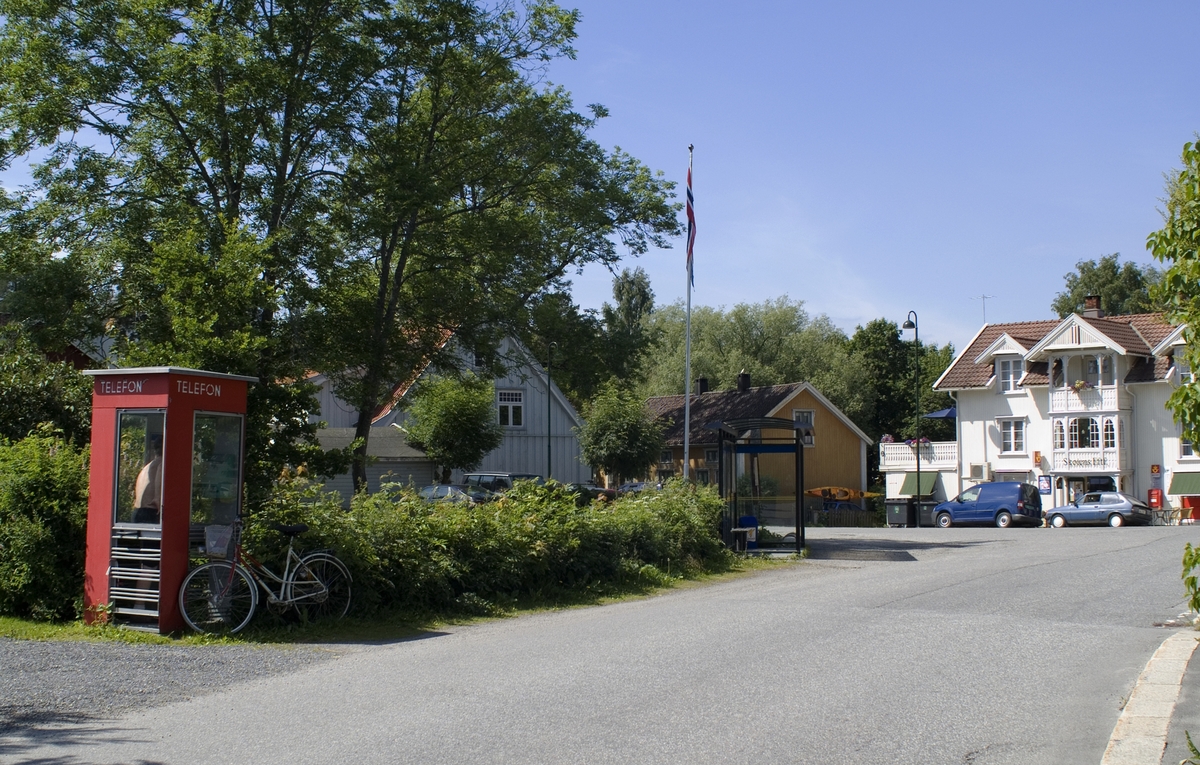 This is the story of how Norway’s most important conversation-space was designed by a young, freshly graduated man from Bergen.

“Norwegian architects are hereby invited…”
In the autumn of 1932, Oslo Telefonanlegginitiated an architectural competition. Finally, Oslo would get its own telephone booth. The city had had so called “talking-stations” from 1885, which in turn were overtaken by automatic telephones 
 only available at selected Narvesen kiosks. The state 
was of the opinion that now was the time to offer the public a better service; public telephone booths open 24/7, like the ones they already had in Sweden and England. But what would they look like, these new telephone booths? What considerations would it
 be necessary to take when designing it? The telegraph board developed a detailed list of demands and restraints: “The booth is intended to be placed outside on the streets and squares and need to be designed so that snow and ice does not hinder the opening and closing of the doors,” they wrote. “To prevent vandalism, theft, uncleanliness etc. inside the booth, it needs to be designed so that from all angles one may see what is going on in there.” Additionally, it would need to withstand storms and bad weather, and “preferably also being whipped by rain mixed with seawater” 

This was not all: The appearance would have to be «pleasing». The booth also needed to be movable, so that it could be taken in to be serviced at Telegrafverket’s main workshops. The reqired material was iron, and the surface was to be spray painted  preferably using car-body paint. There was a requirement for “a writing shelf, a pack shelf, and a suitable place for the telephone catalogue.” Also, there would need to be an illuminated TELEFON  sign, easily visible from all four angles. The total cost for each booth should not exceed 1000 kroner. The first prize for coming up with such a product was 800 kroner.

“Norwegianarchitects are hereby invited to partake in a competition for the design of a telephone booth…”  

The man with the solution
«At some point in 1932, Georg Fredrik sat at a party in Bergen. Maybe he felt a bit lost and forgotten as he often had throughout his life. He retreated to a quiet corner, took out a pencil and strted doodling on a matchbox.  According to my mother, this was how the telephone booth came into being.” In the book “Norges lille røde  historien om telefonkiosken,” Lars Fasting describes his father, the man who is far less known than the iconic architctural structure he left behind. Georg Fredrik Fasting was from Bergen, born into a family of working people and smallholders. One unusual facet of Georg Fredrik was that he was born without ears. His mother made sure he learnt to speak, read and write, 
ut Lars Fasting indicates that his father would seek refuge in drawing when the social challenges became too much to bear. And in the end drawing became his profession. In 1924 he secured a guarantor for a student loan, and started studying to become an a
rchitect at the NTH. Throughout the 1930s he entered several architectural competitions, with drafts produced, according to his son, “after work and in the late hours of the night.”

His efforts were not wasted. Out of 93 entries, with names such as “Flirt”, “Brrr”, “Ring” and “Amor”, the jury selected Fasting’s submission, “RIKS” as the new telephone booth: “The draft shows a strikingly simple solution to the task, technically as well as aesthetically well worked out.”

Taut and provident
Simple and aesthetc are the keywords here. Fasting had designed a booth pointing towards the future, and to modernism. Just how modern it was can be seen by comparing RIKS to the British telephone booth, also designed in the interwar-era. While the British version with it classicistic style is looking back to the heyday of the empire, Fasting’s booth is progressive and functionalistic. Like most Norwegian architects, Fasting broke with the classicistic style of architecture after the Stockholm-exhibition in 1930. “After it, almost all buildings erected in Norway until the German invasion in 1940, were in the functionalistic architectural style,” writes senior curator of architecture at the Norwegian National Museum, Ulf Grønvold, in the book, “Den lille røde”.“TheNorwegian booth is a piece of functionalistic architecture, an asymmetric composition with its roof slab overhanging the word TELEFON, in bold sans seraph lettering,”concludes Ulf Grønvold.

Fashionably red
And it was red. Fasting chose a colour which was part of the modern palette. “A bright red colour, but not as shiny as a signal red, the character of the colour places it among the fashionable colours within functionalism,” states paintings conservator and researcher in NIKU (Norwegian Institute for Cultural Heitage Research), Jon Brænne. In his opinion, Fasting went for visibility without making the booth stand out too much from its surroundings. The original colour was in use up to around 1950, when it changed to signal red. Towards the end of the 1970s the clour was again adjusted towards today’s orangey red.

The design, however, has not changed. RIKS is eighty years and still looks remarkably good. That’s what makes Fasting’s telephone booth a classic  even before it was added to DOCOMOMO’s list over moden icons of design. For Telenor, the telephone booth has served as a pathway into the hearts of the public. For many, Telenor (Televerket) was synonymous with exactly this telephone booth, because this was where one would go to place a call. Having a home
phone was not common until the 1980s. As such the red box became part of the Norwegian everyday and consciousness. The symbol- and publicity value of this is hard to evaluate, but in 2007 it was time to give honour where honour was due, Telenor, in consul
tation with the Directorate for Cultural Heritage, decided to preserve 100 telephone booths for all eternity.

And what about Georg Fredrik Fasting? What happened to him? At the age of 56 an entry in his diary states: «I CAN HEAR». As the first person in th world he had undergone an operation where he had ear canals constructed and eardrums fitted. For the rest of his life, the man behind Norway’s own telephone booth could answer the telephone himself.

Source: Norges lille røde historien om telefonkiosken (2007), issued by The Norwegian Telecom Museum and Telenor Cultural Heritage.