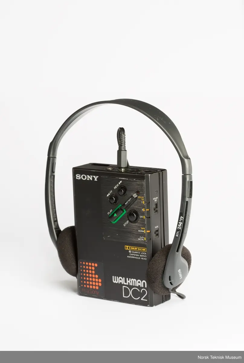 Med originalveske og øretelefoner