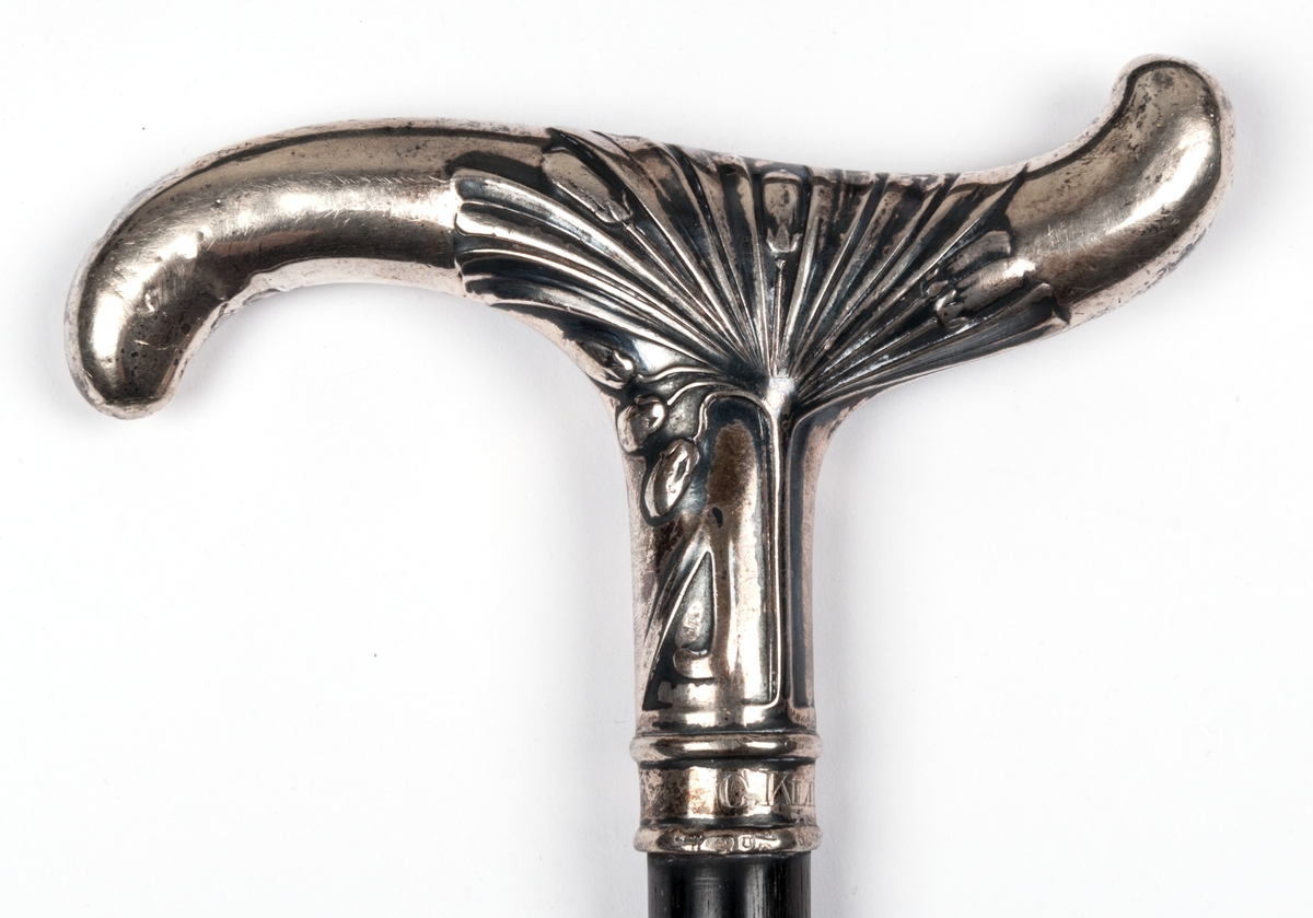 Köpp, ebenholz, silverkrycka, märkt C. Klintberg.