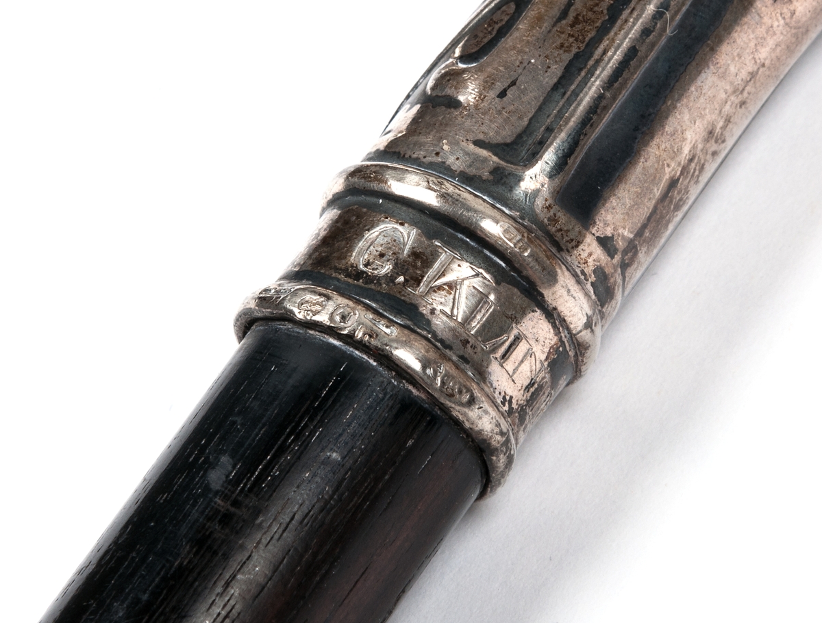 Köpp, ebenholz, silverkrycka, märkt C. Klintberg.