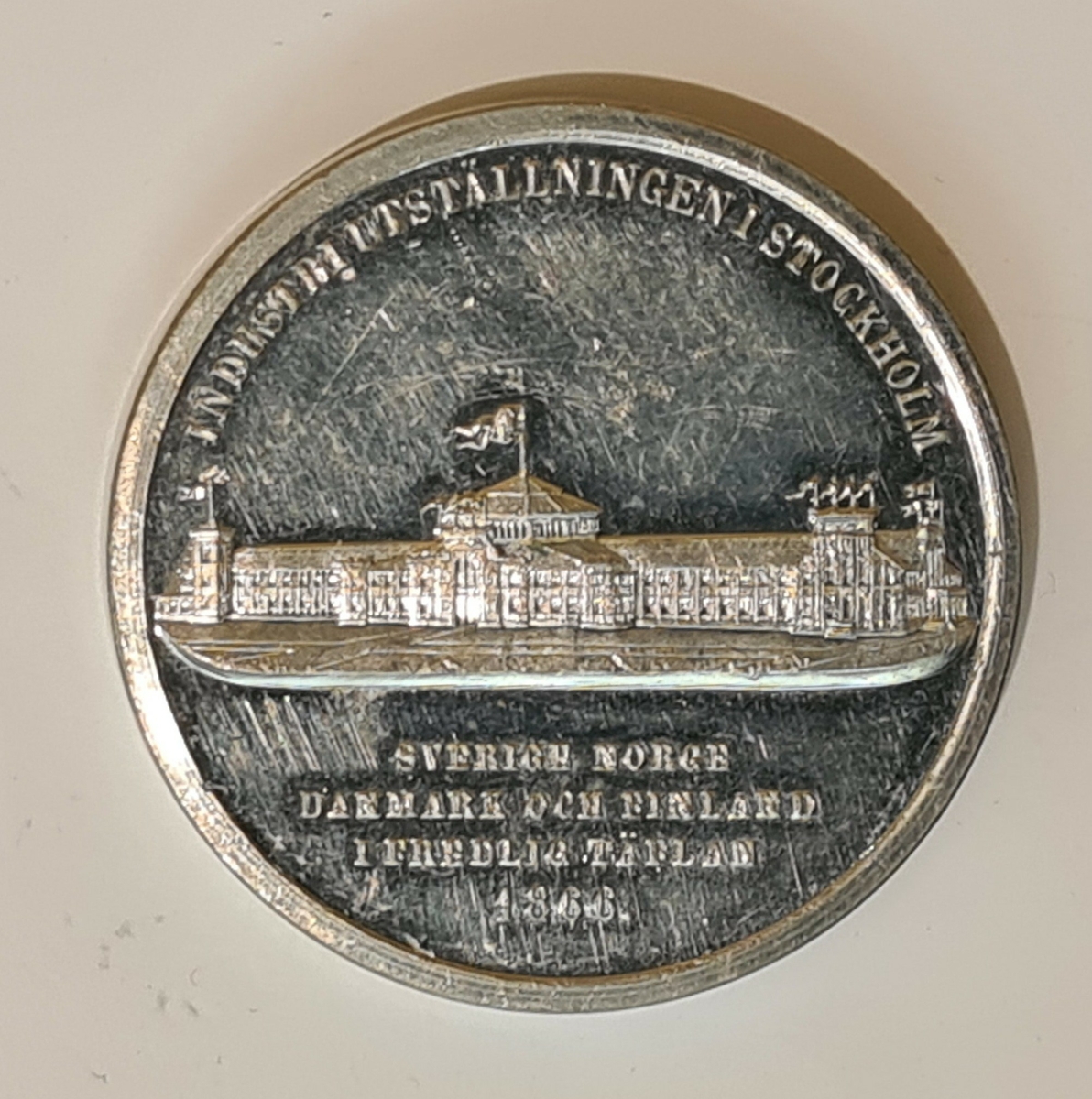 Minnesmedalj präglad med anledning av Allmänna Industriutställningen
i Stockholm 1866.