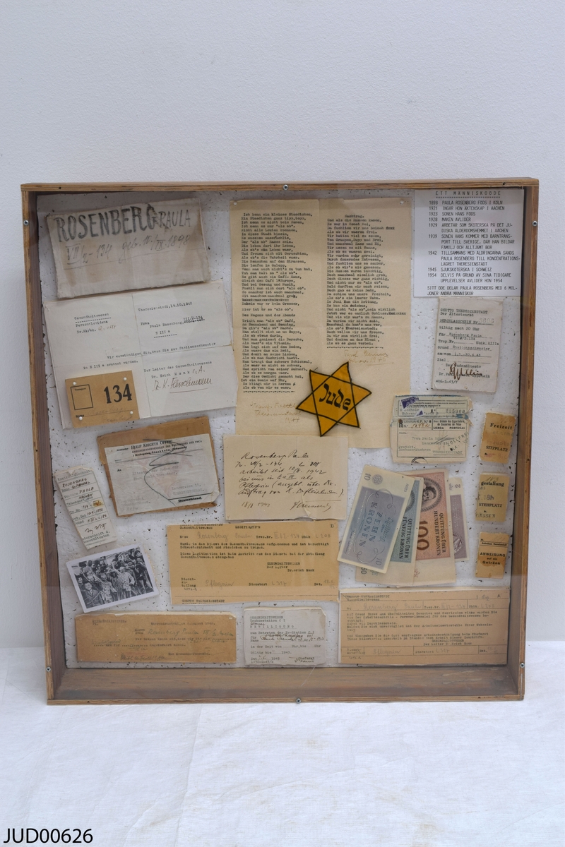 Tråläda med en akrylskiva över, innehållande minnesdokument som tillhört Paula Rosenberg.