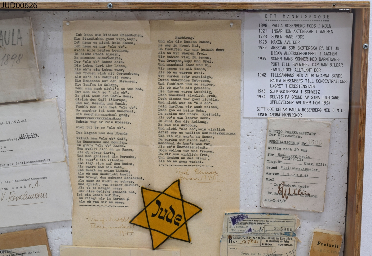 Tråläda med en akrylskiva över, innehållande minnesdokument som tillhört Paula Rosenberg.