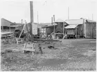 H län, Hamnförrådet i Kalmar. Avvecklades 1946. Översikt med diverse förrådsbyggnader, upplag av diverse material, 