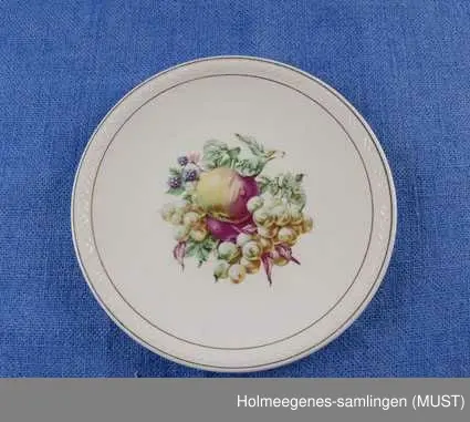 Fruktmotiver, gull-staffasje, støpt bord langs kanten.