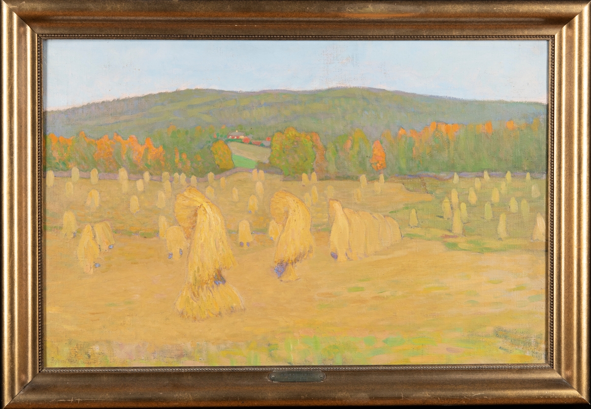 Odlingslandskap med skördad rågåker, verkets titel syftar på det sätt som rågkärvarna ställts för att torka. I fonden syns ett flackt berg och några byggnader.