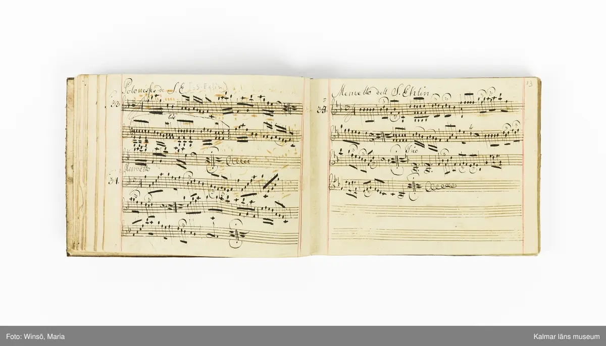 KLM 21071. Notbok, handskrift. Tvärformat. Helt skinnband med marmorering samt guldpräglade dekorelement. På pärmens framsida: VIOLINO PRIMO. På försättsbladet: I:N:J:C. samt Adam Lorentz Stålhammar ao 1773. Därefter handskrivna kompositioner, menuetter.
