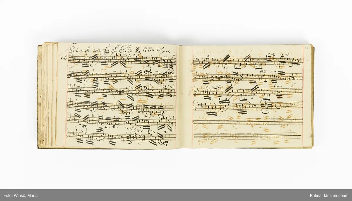 KLM 21071. Notbok, handskrift. Tvärformat. Helt skinnband med marmorering samt guldpräglade dekorelement. På pärmens framsida: VIOLINO PRIMO. På försättsbladet: I:N:J:C. samt Adam Lorentz Stålhammar ao 1773. Därefter handskrivna kompositioner, menuetter.