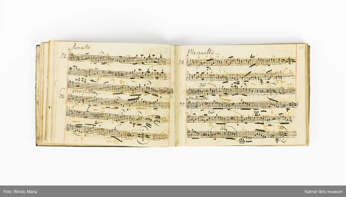 KLM 21071. Notbok, handskrift. Tvärformat. Helt skinnband med marmorering samt guldpräglade dekorelement. På pärmens framsida: VIOLINO PRIMO. På försättsbladet: I:N:J:C. samt Adam Lorentz Stålhammar ao 1773. Därefter handskrivna kompositioner, menuetter.