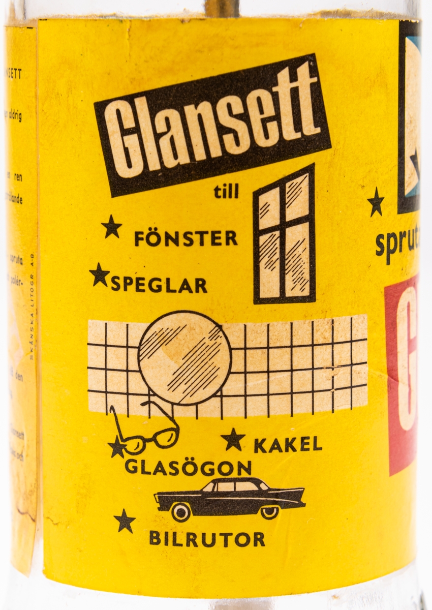 Glasflaska med pump av metall. Gul etikett men texten "Glansett". Har innehållit putsmedel till blanka ytor som glas och kakel.