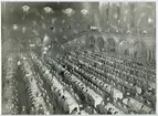 Representanter för Sveriges Lottakårers Riksförbund samlade vid dukade bord i Blå hallen,Stockholms Stadshus, 1949. 25års jubileum