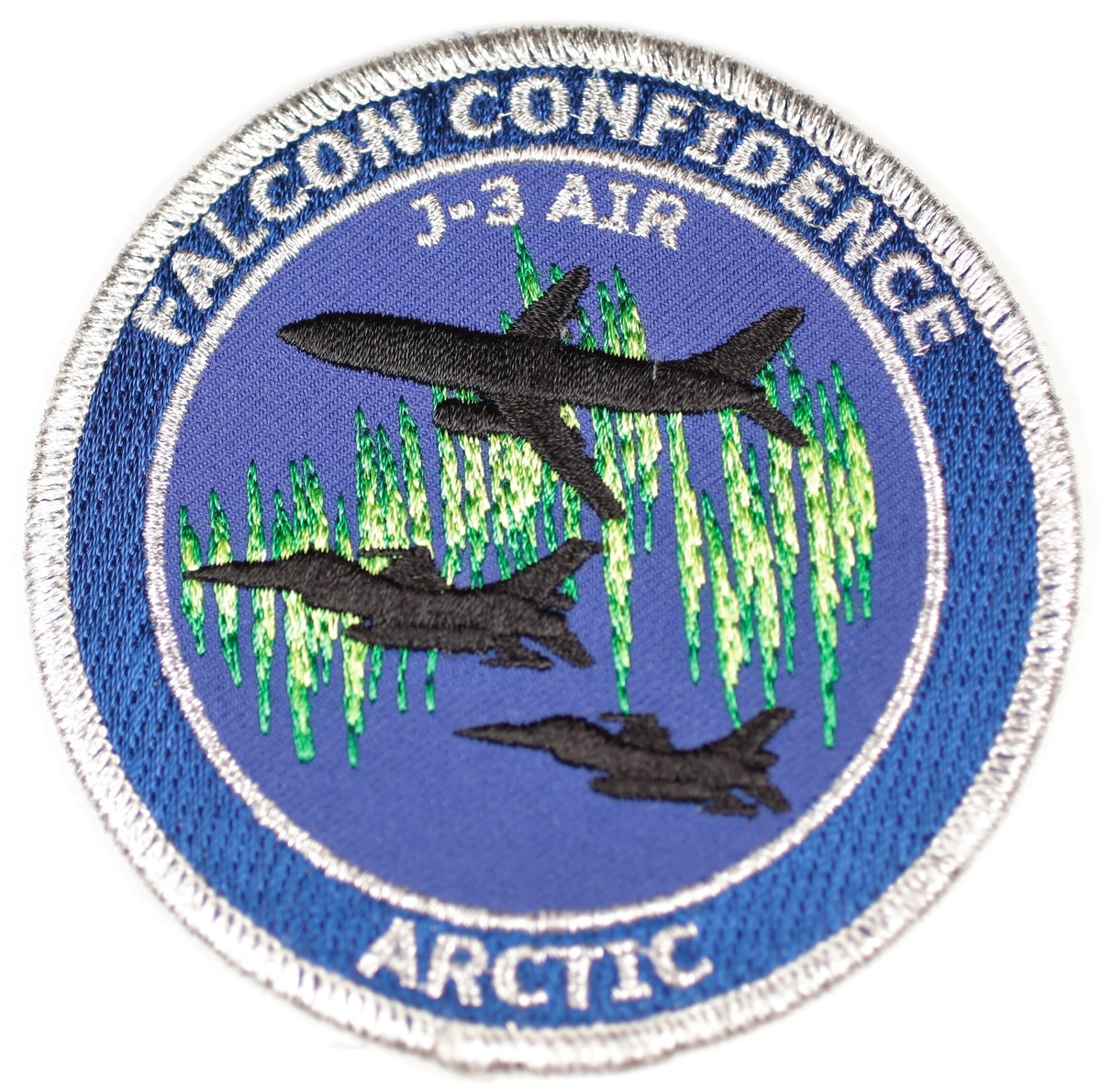 Tøymerke til bruk på feltuniform/arbeidsantrekk.  2 x F-16 jagerfly sammen med Boeing 737 type.