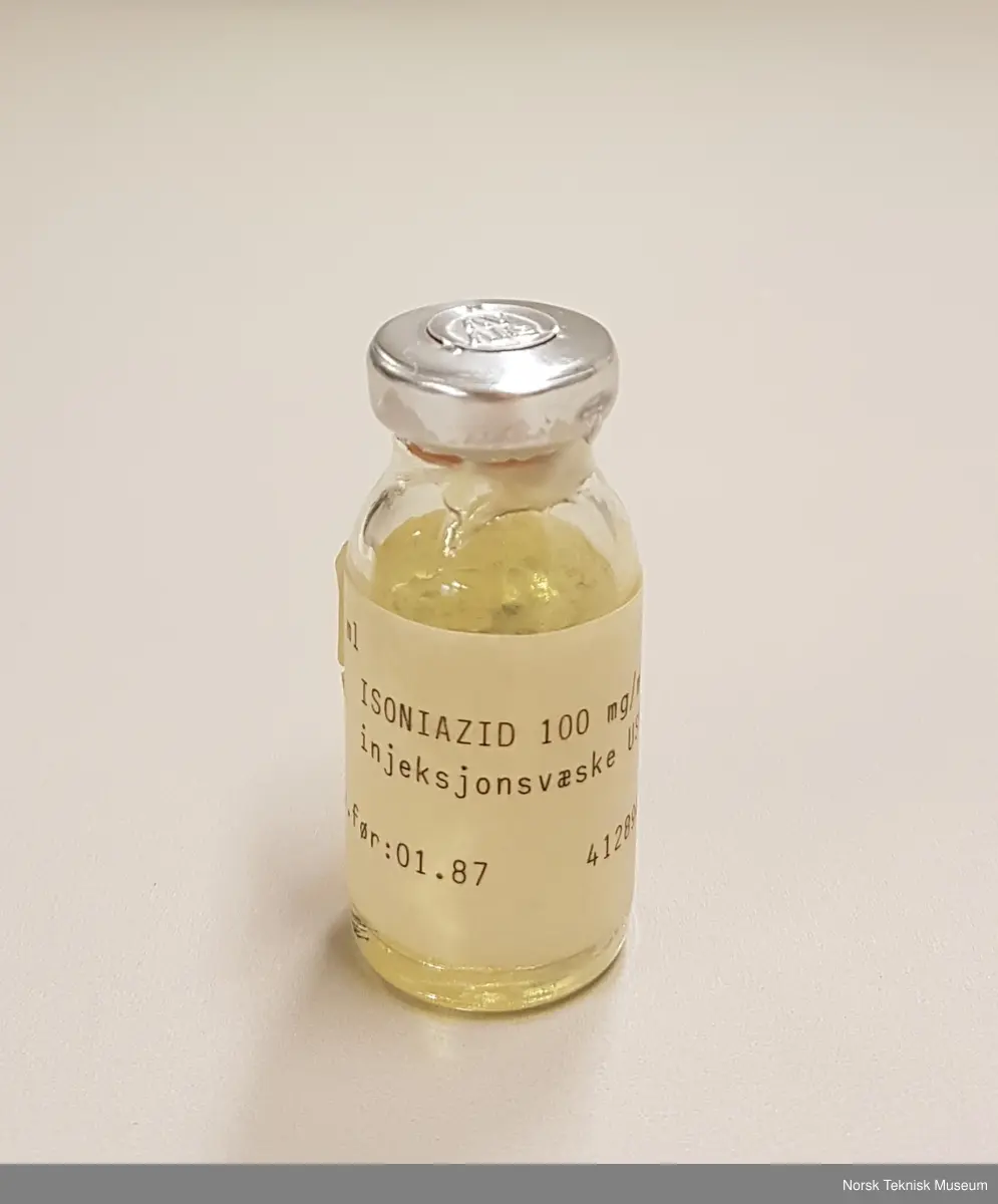 Liten medisinflaske med blankt innhold.