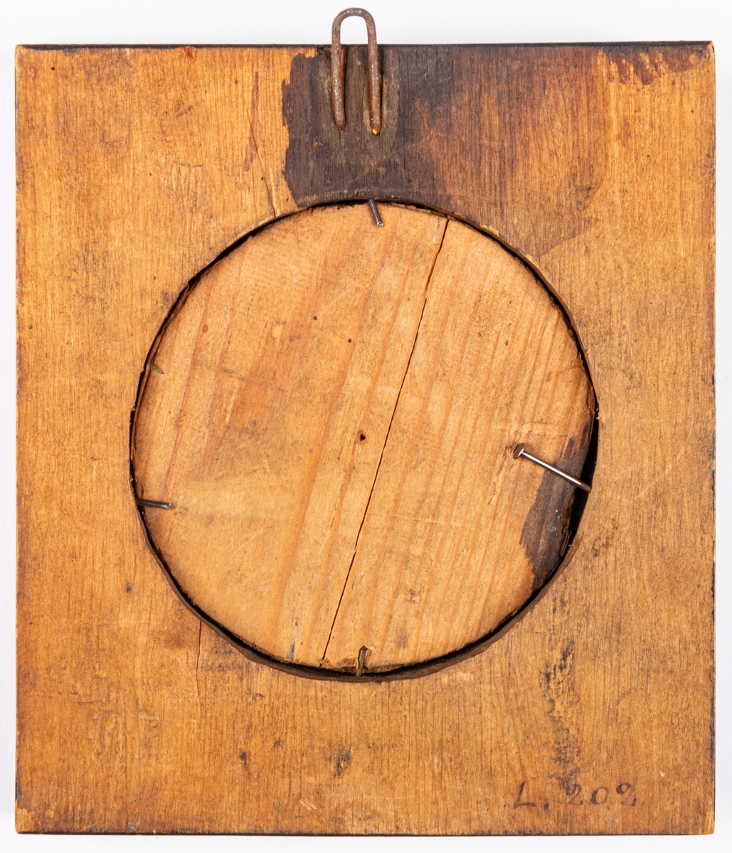 Porträttmedaljong, relief i järn, föreställande Karl XIV Johan, inom svart träram.