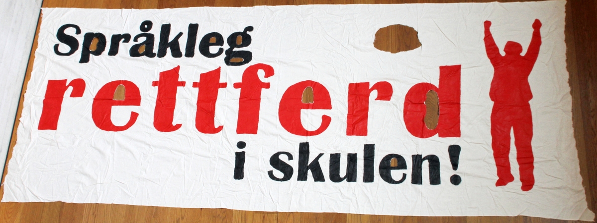 Banner frå arkivet til Norsk Målungdom. På banneret står teksten: "Språkleg rettferd i skulen!". Det er truleg at banneret har vore i bruk under ein dialektaksjon for Norsk Målungdom.