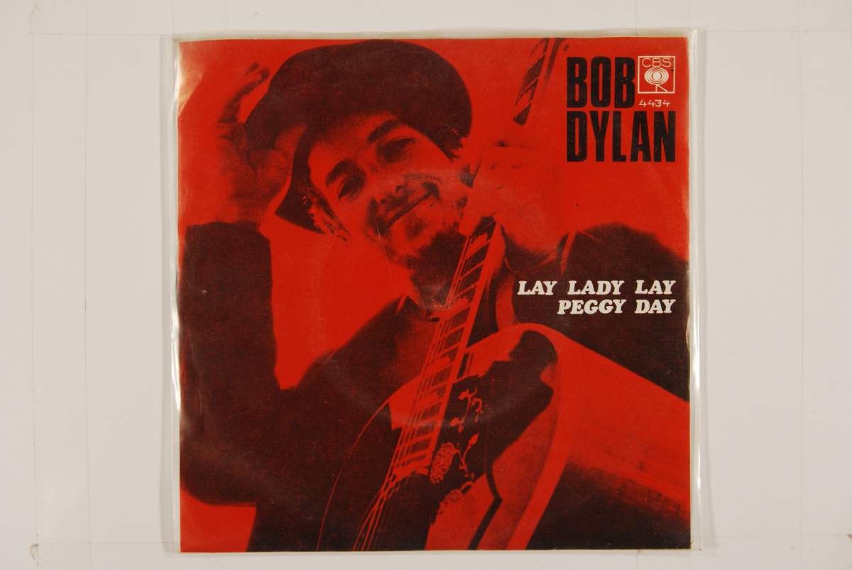 Bilde av Bob Dylan med gitar.