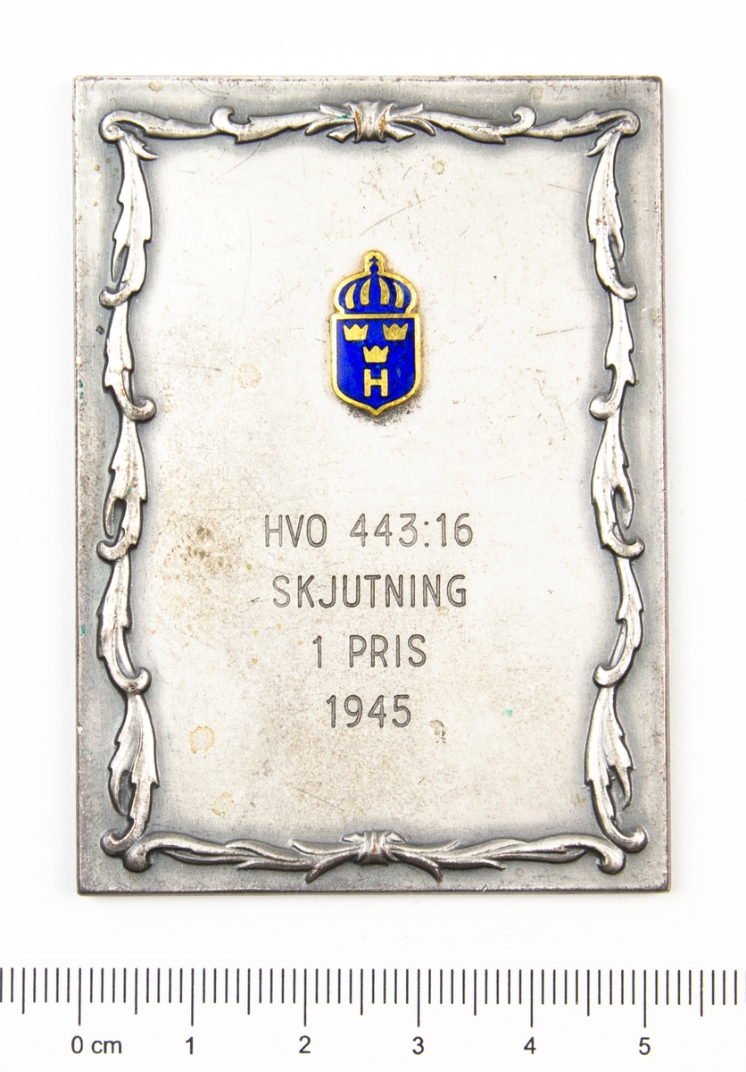 Hemvärnets organisationsmärke i guld och blå emalj. Skjutning 1 pris 1945