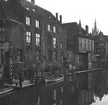 Byggnader längs med en kanal i Brygge. Tyskland-Holland-Belgien 1938.