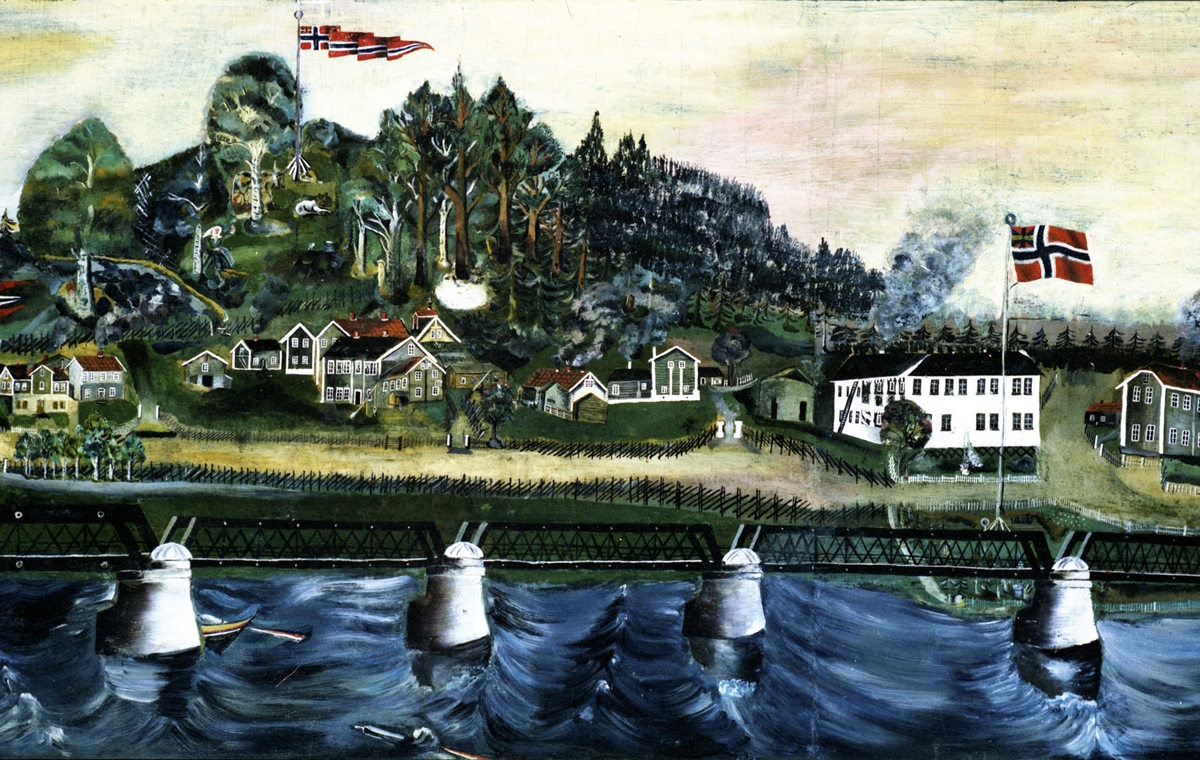 17. mai i Leiret i Elverum med Glomma i forgrunnen, ved den gamle brua, en jernkonstruksjon.