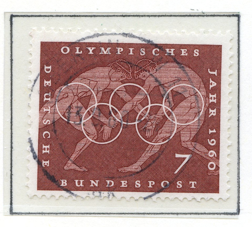 Syv frimerker med motiver fra de klassiske greske olympiske leker montert på albumark i størrelse A4. De første fire frimerkene viser øvelser fra de klassiske lekene med ol-ringene i forgrunnen, og ulik bakgrunnsfarge. Disse er utgitt i Tyskland, i fbm med sommer-OL i Roma 1960. Et frimerke utgitt i Paraguy i 1980 viser hodet til Satyros (gresk arkitekt fra antikken) plassert på et ark som viser ruinene etter Olympiastadion. De to siste frimerkene viser en gresk atlet fra antikken med de olympiske ringer over. Frimerkene er utgitt i Saarområdet (på gensen mellom Tyskland og Frankrike), som hadde sin egen olympiske komité i årene etter første og andre verdenskrig.