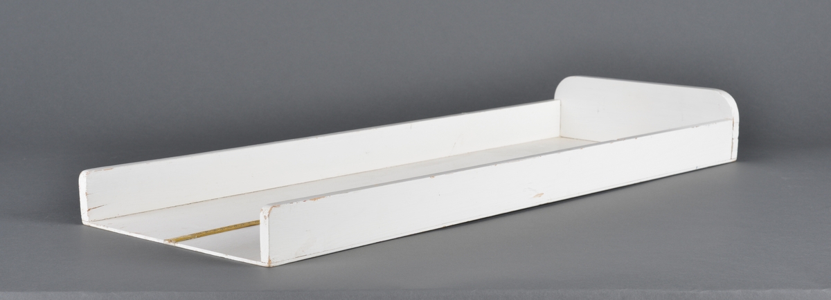 Brett beregnet til måling av spebarn.
Består av to deler. En trekasse og et løst skyvbart håndtak for å regulere etter barnets lengde.